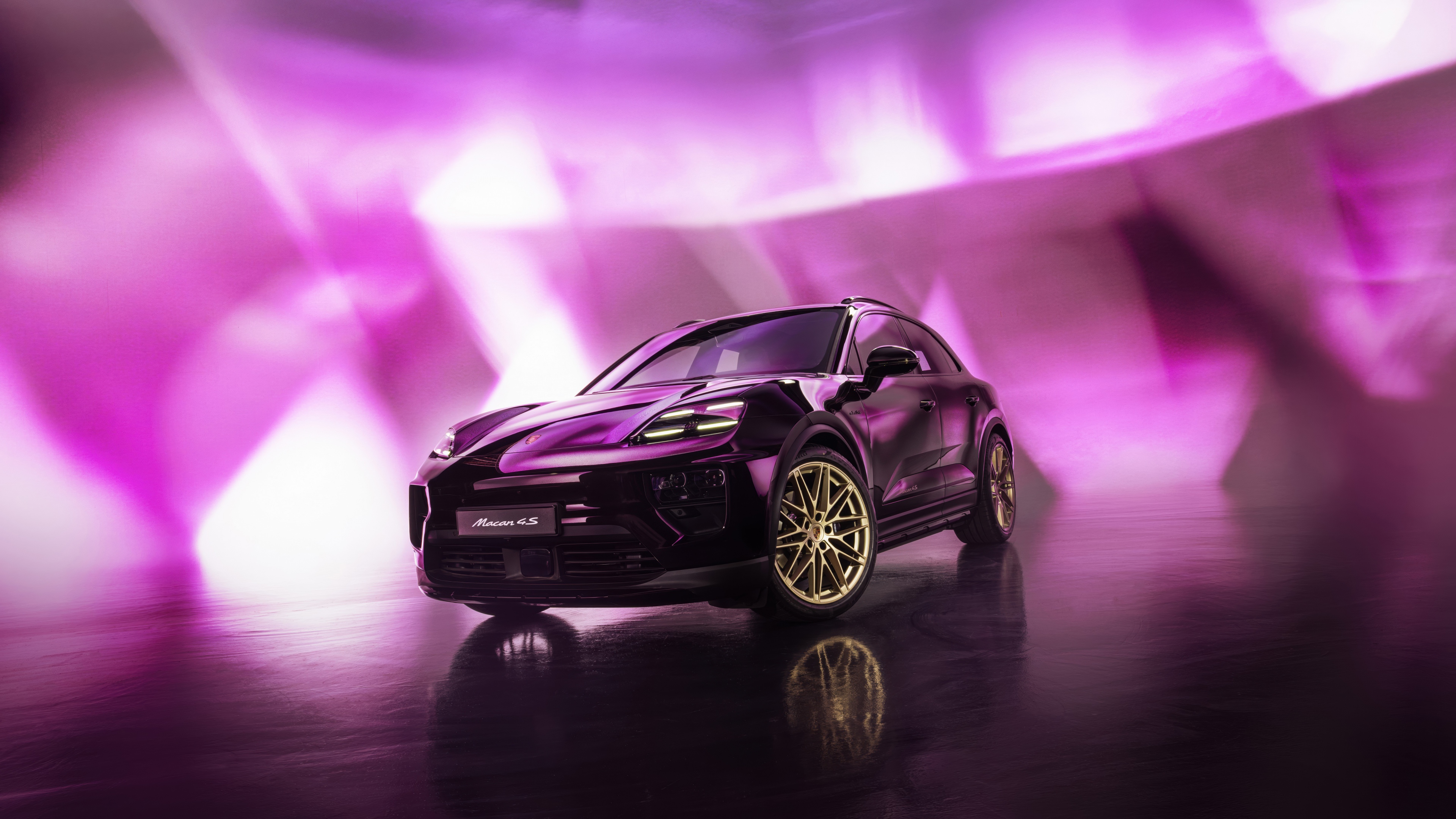 A high-detail close-up of a pink Porsche Macan luxury SUV in a soft pink aesthetic setting.