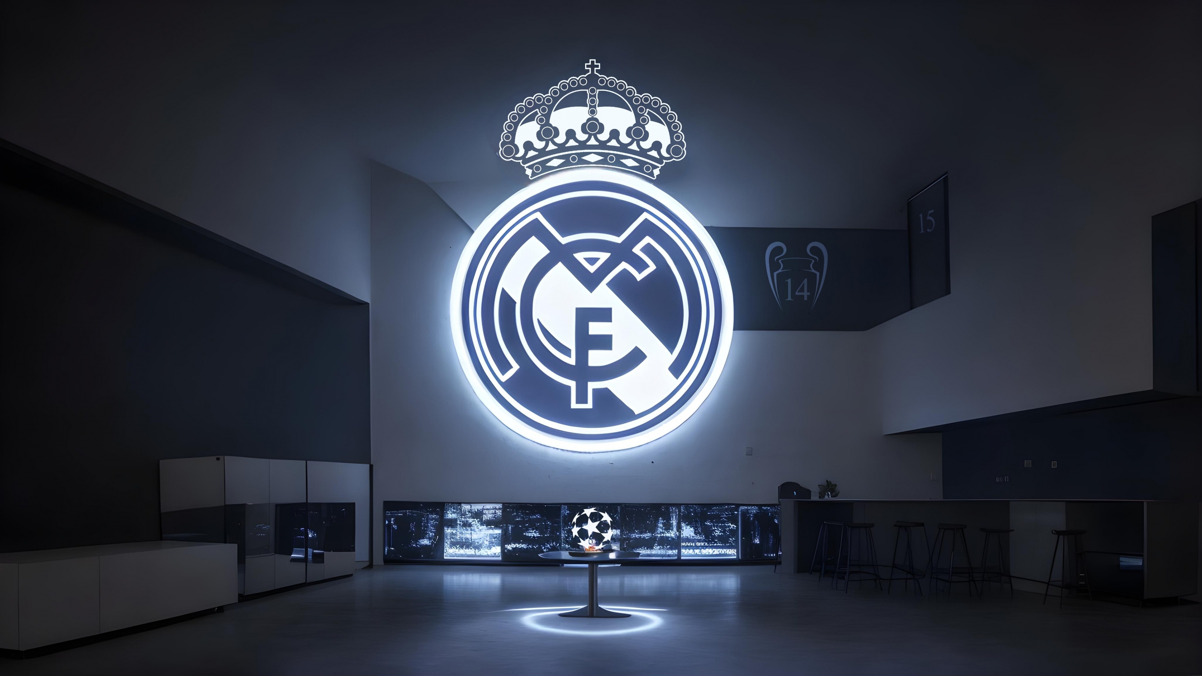 A vibrant, glowing Real Madrid CF football club logo with neon-like light effects.