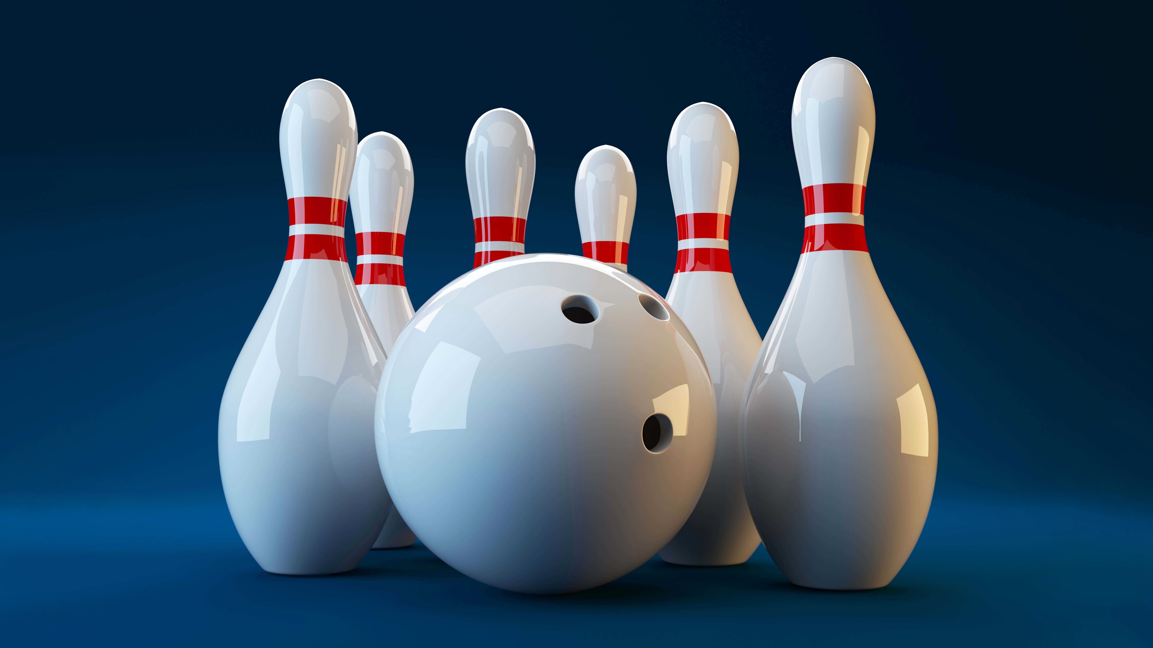 White bowling pins and a bowling ball set against a bright blue background.