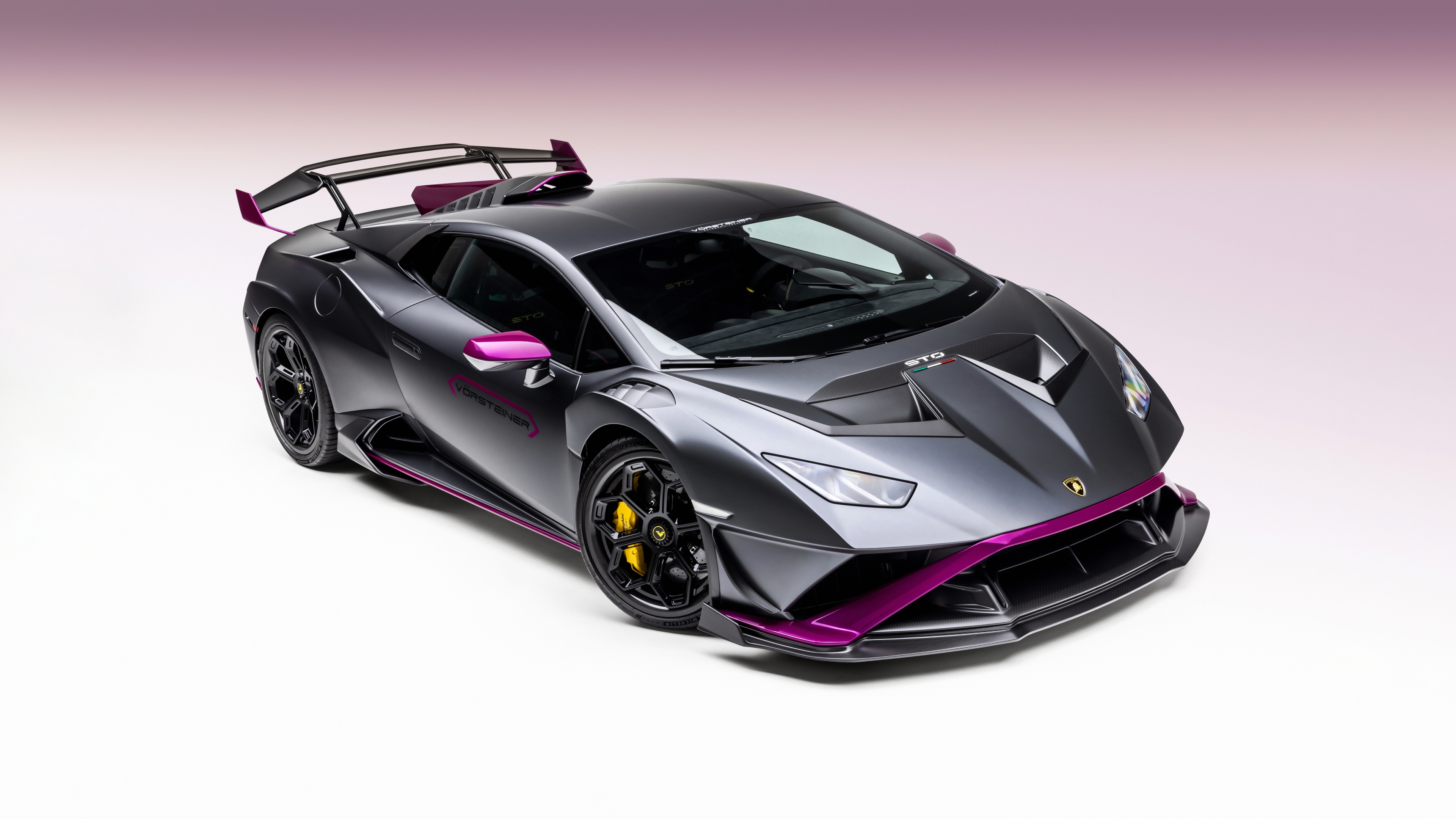 A high-resolution, detailed shot of a Vorsteiner modified Lamborghini Huracan STO supercar showcasing its aerodynamic design.