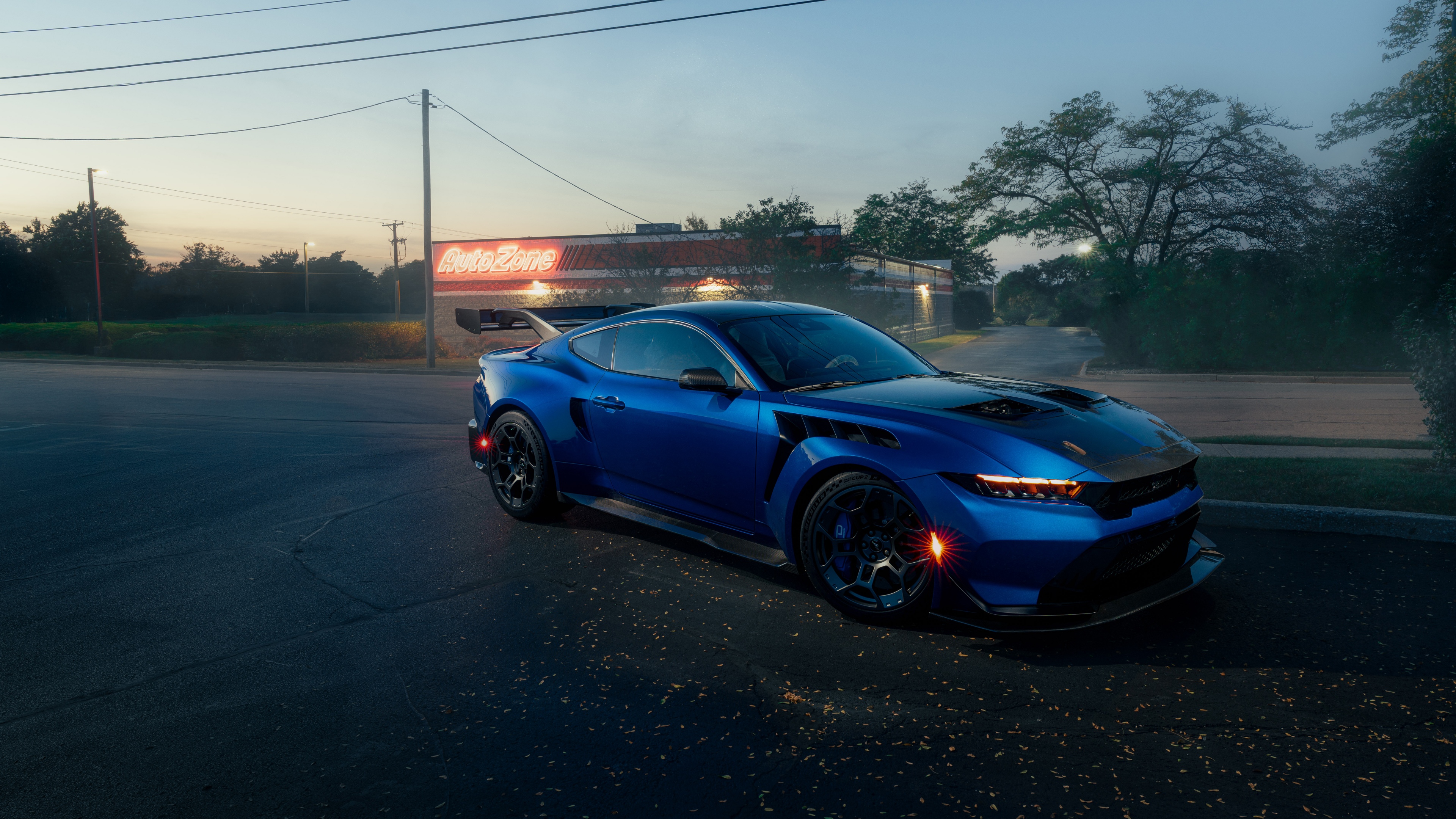 A cinematic, high-detail close-up of the 2025 Ford Mustang GTD with Performance Pack, highlighting its aerodynamic lines and premium automotive engineering.