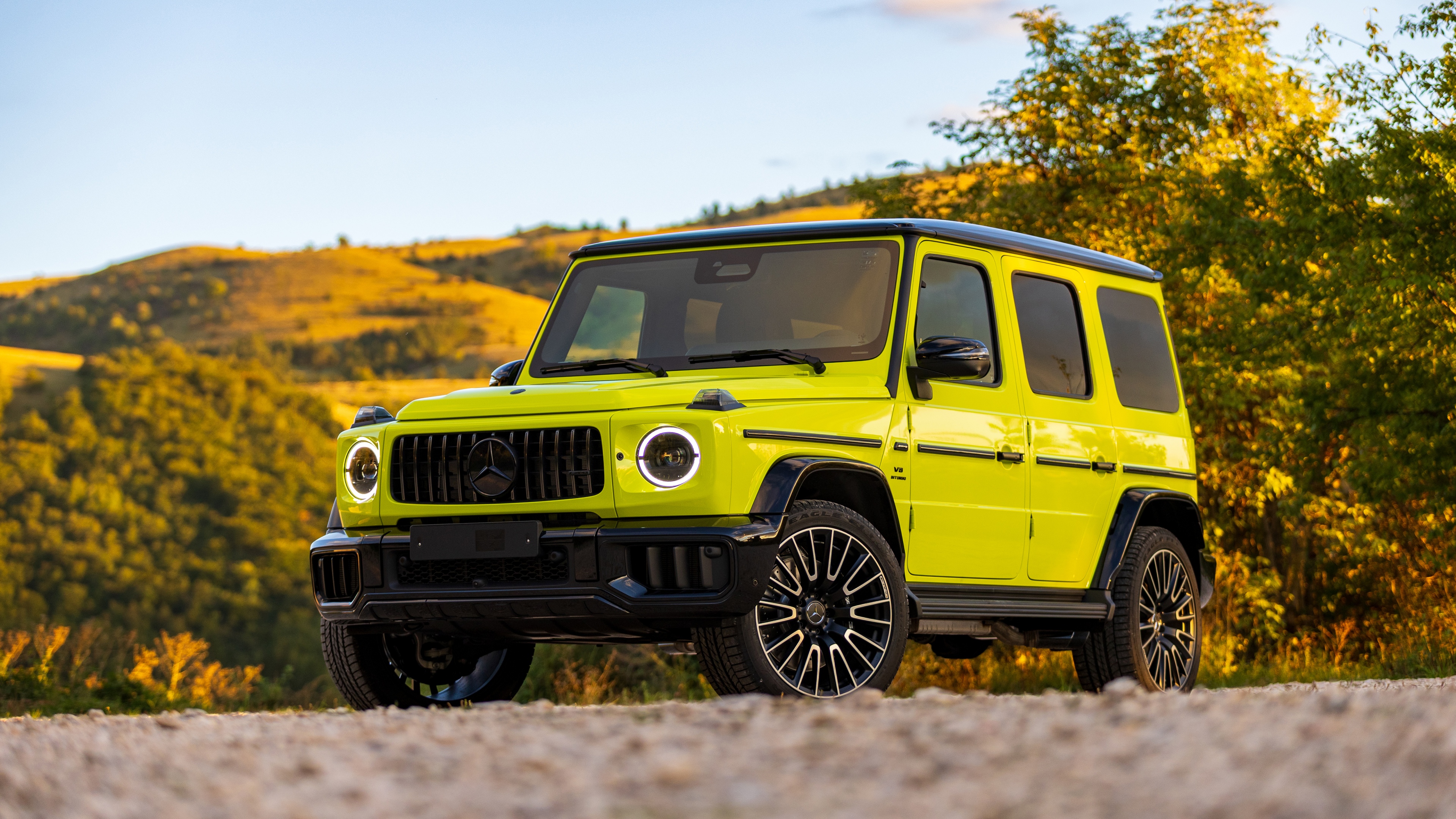 A sleek and powerful 2025 Mercedes-AMG G 63 G-Wagon in a professional studio setting.