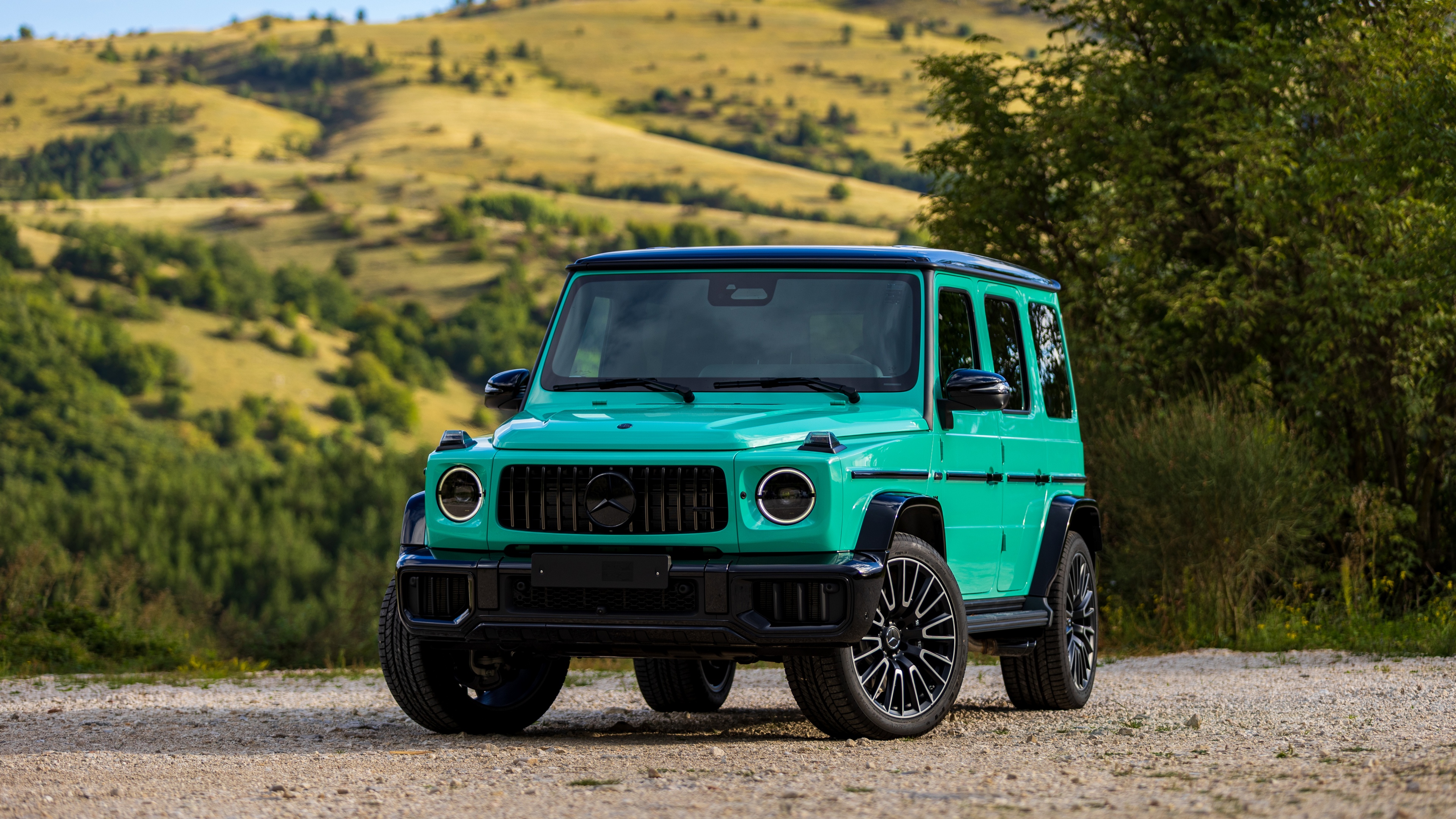 A high-detail, 5K resolution shot of the 2025 Mercedes-AMG G 63 luxury SUV.
