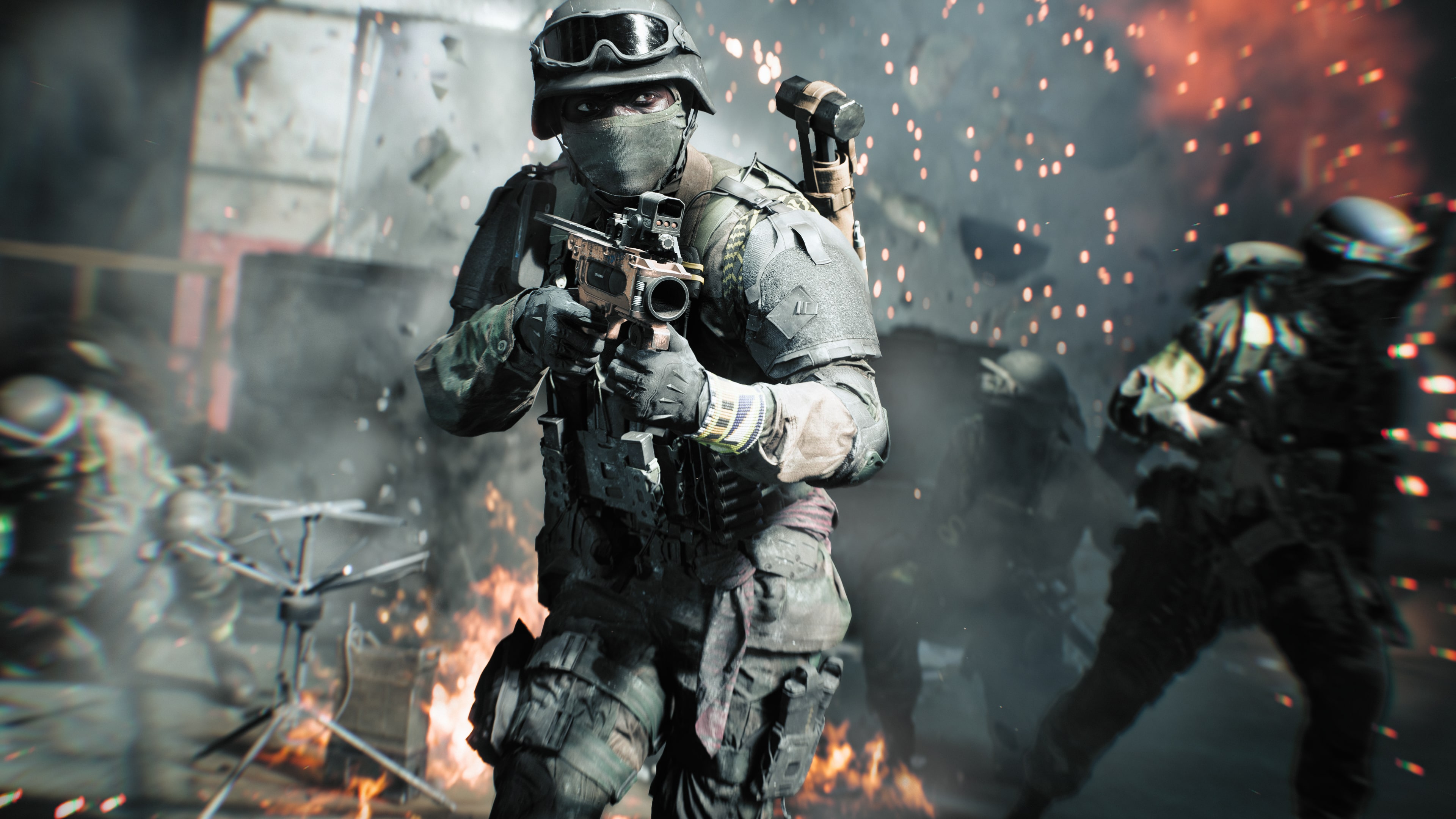 A soldier in modern military combat gear moving through a war-torn battlefield with explosions and debris in Battlefield 6 gameplay.