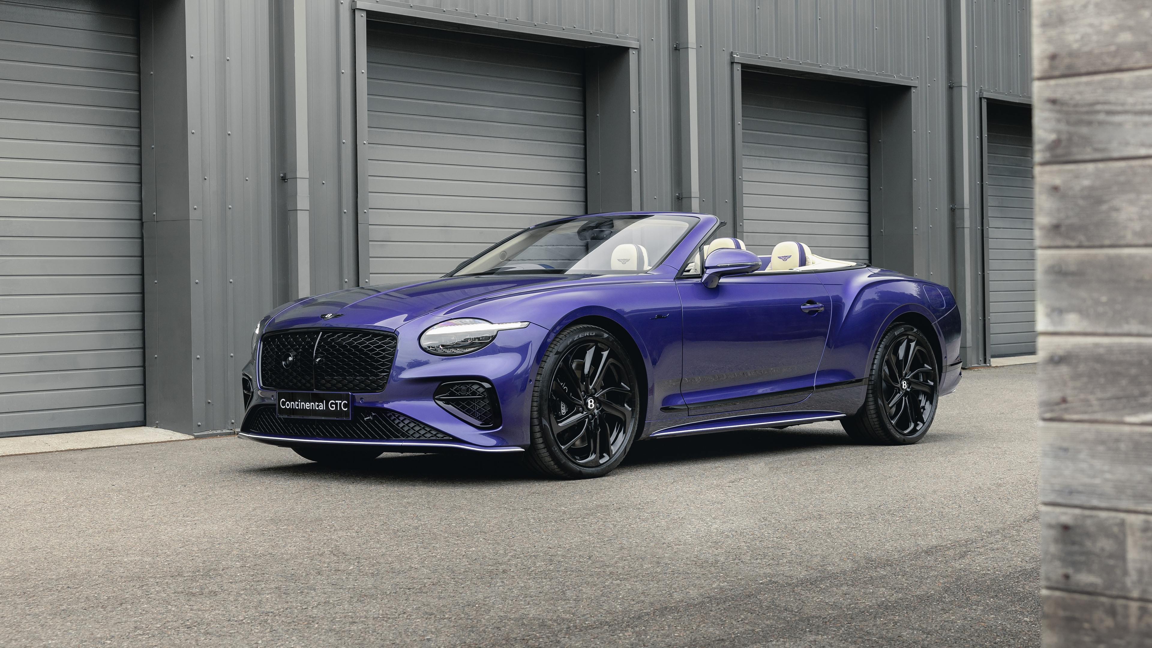 A high-resolution, detailed shot of a Bentley Continental GT Speed Convertible, a luxury grand tourer.