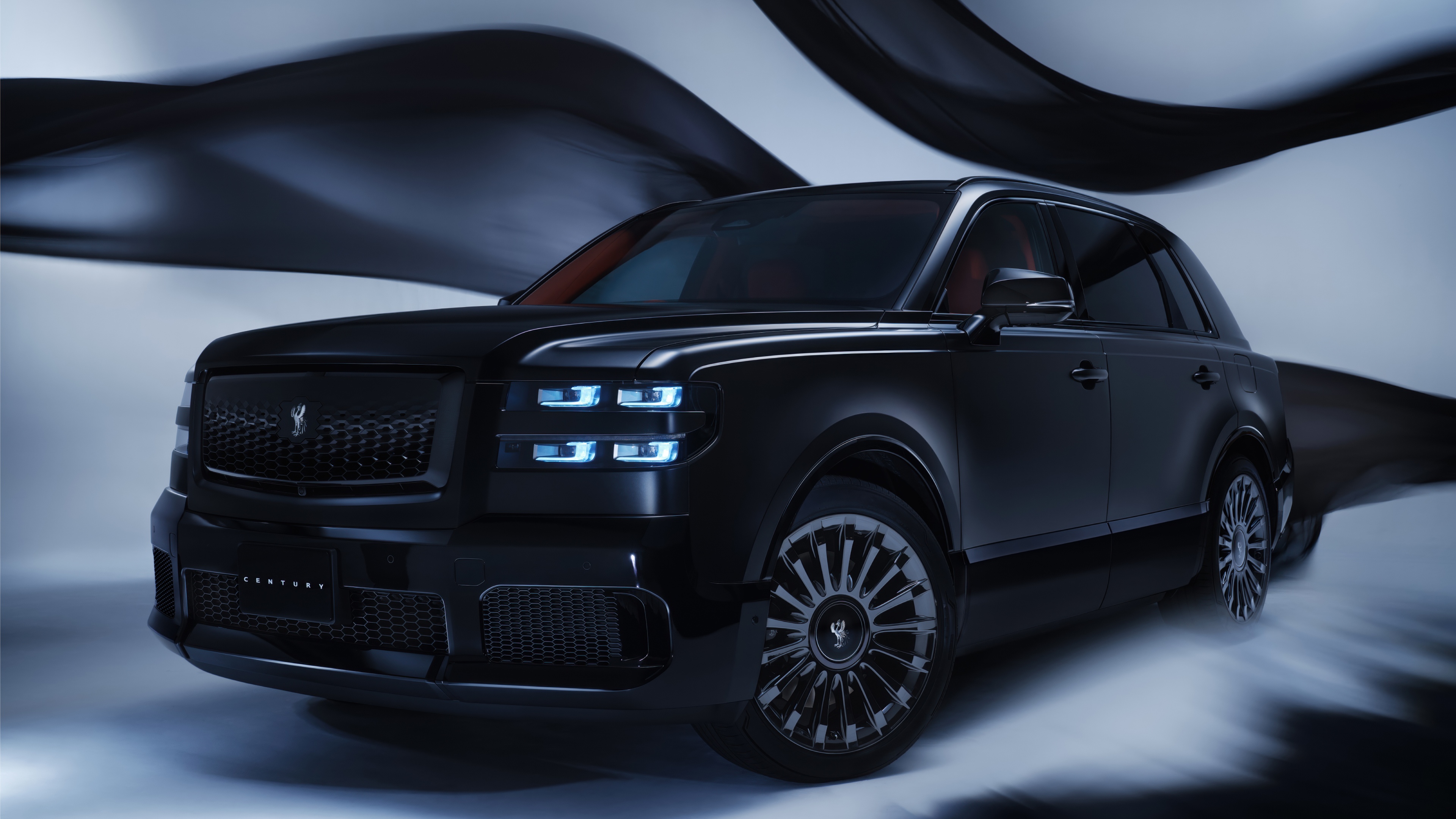 A collection of sleek, glossy black luxury cars with futuristic 2025 designs.