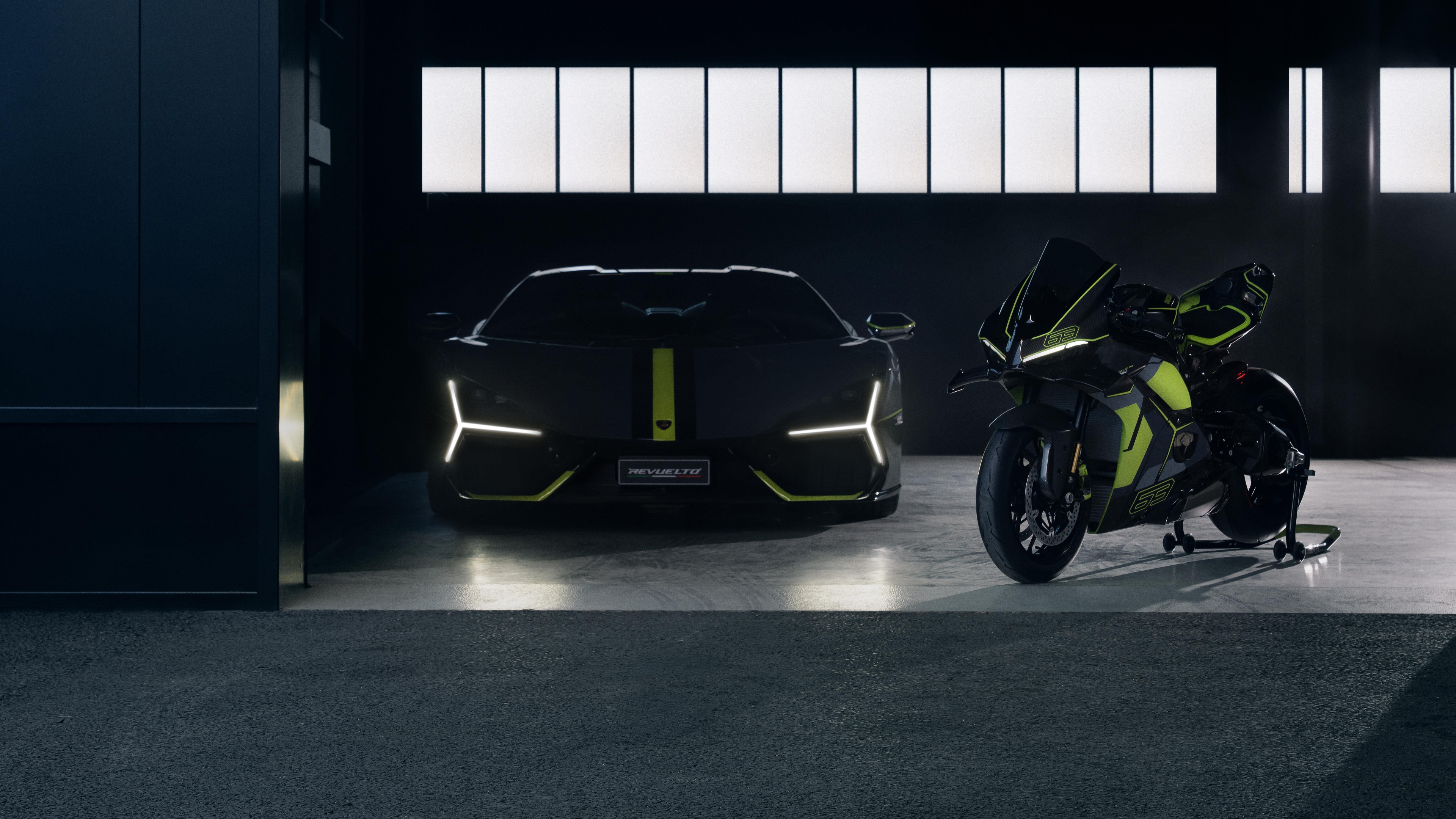 A sleek Lamborghini Revuelto supercar parked alongside a high-performance Ducati Panigale V4 motorcycle in a high-resolution studio setting.