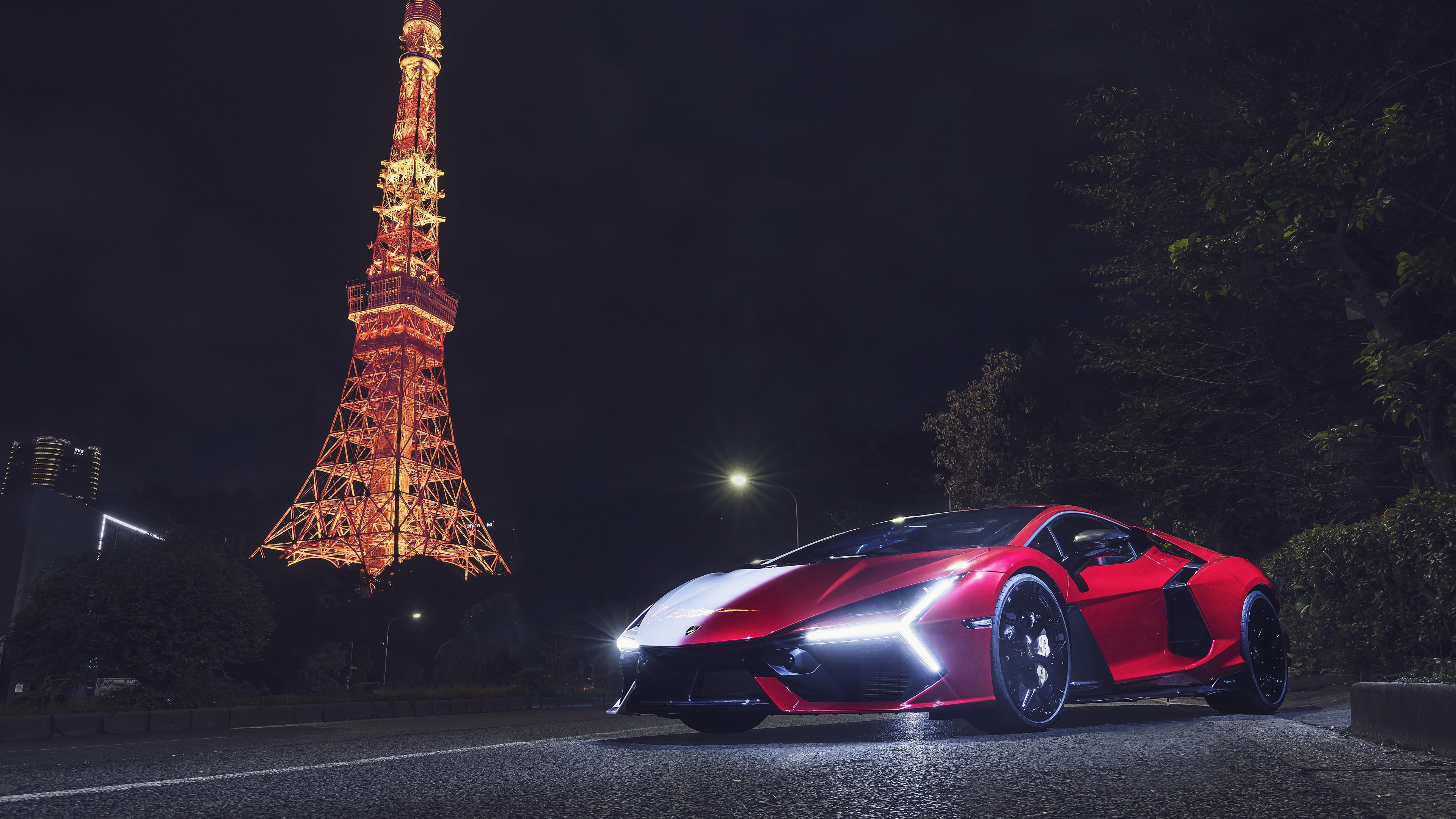 A sleek Lamborghini Revuelto parked at night in front of the illuminated Tokyo Tower, featuring a vibrant anime art style and neon city lights.