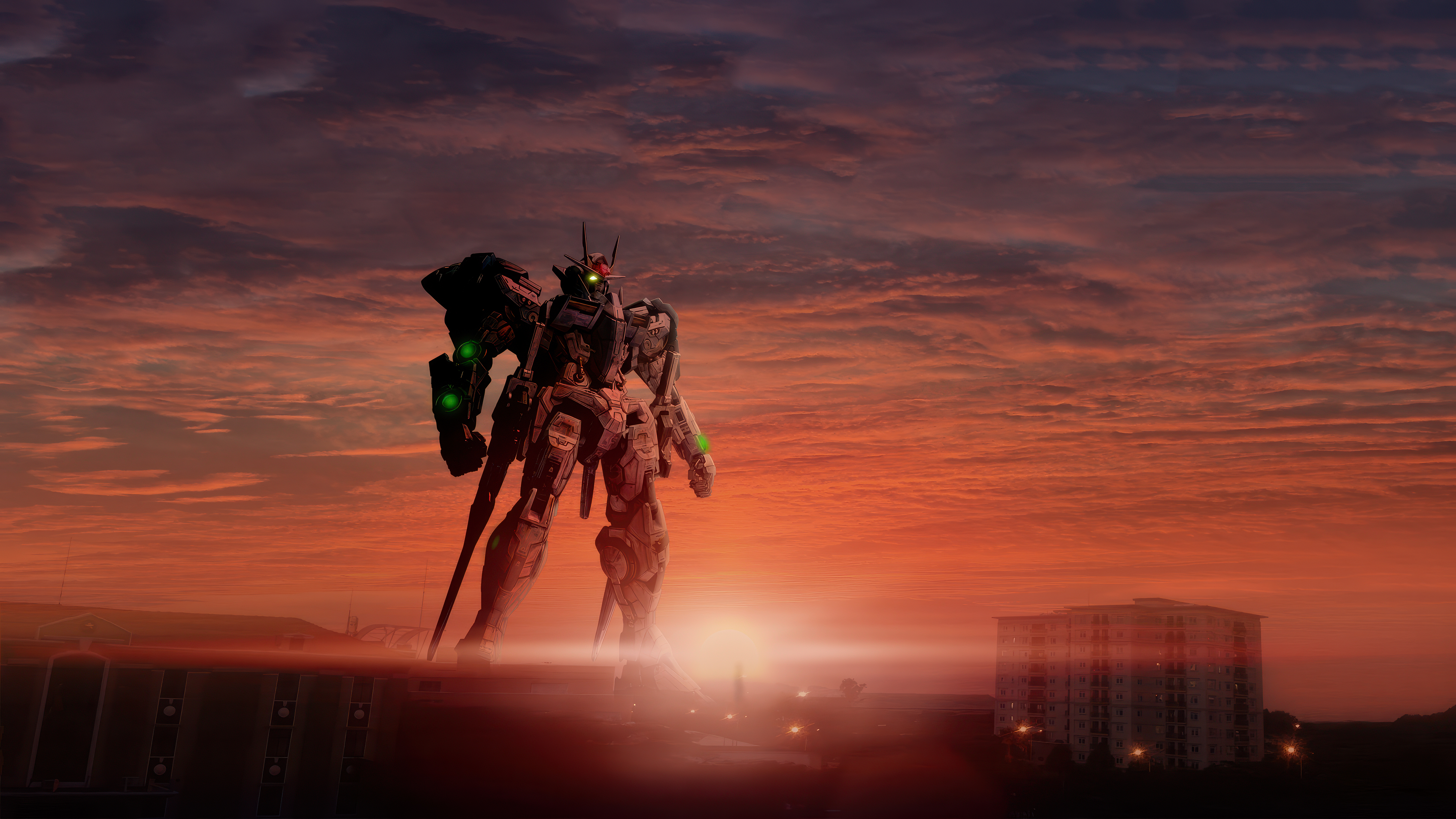 A large Gundam-style robot silhouetted against a dramatic, colorful sunset sky.
