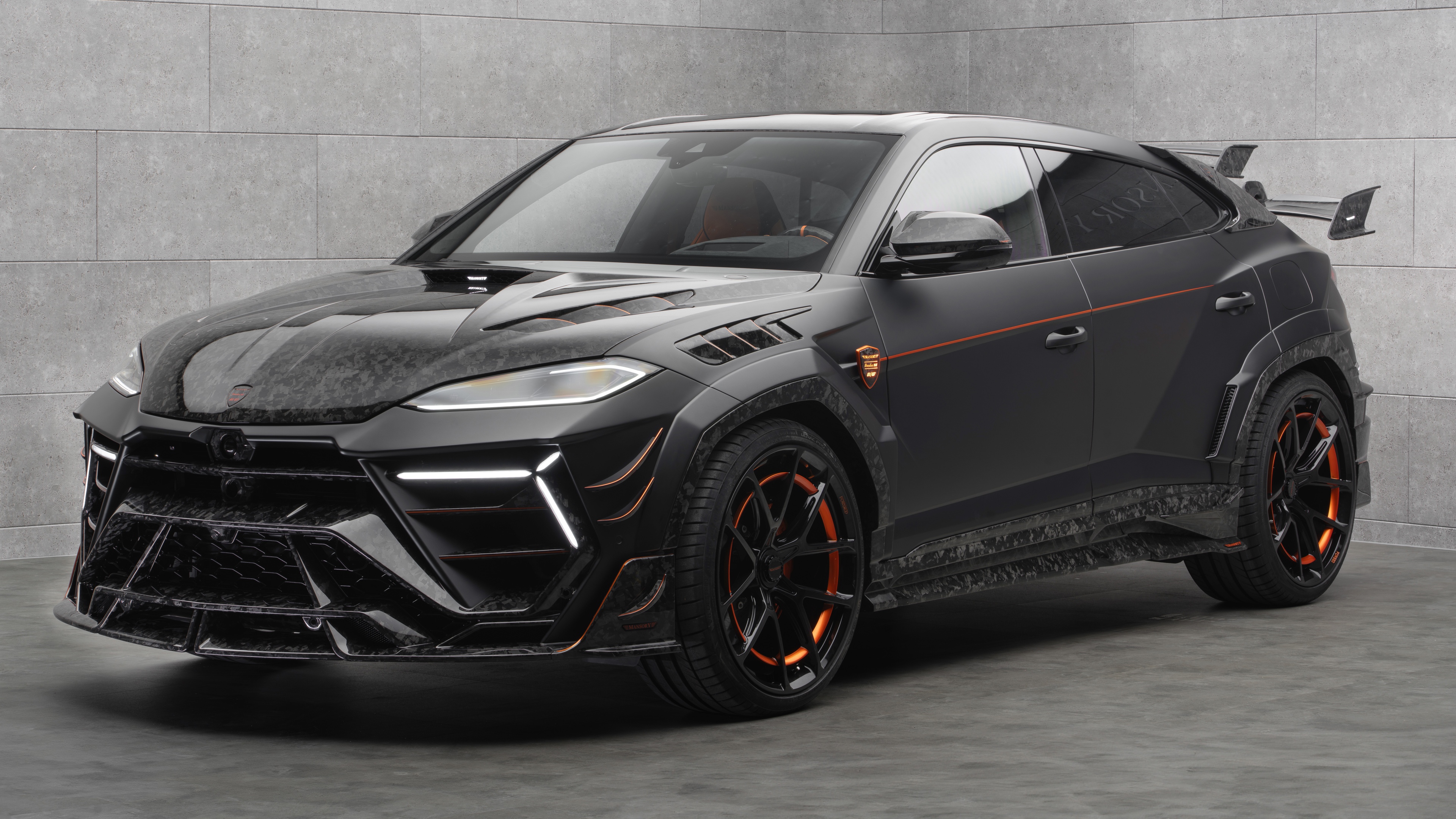 Mansory Venatus Lamborghini Urus SE luxury SUV with aggressive body kit on a grey background