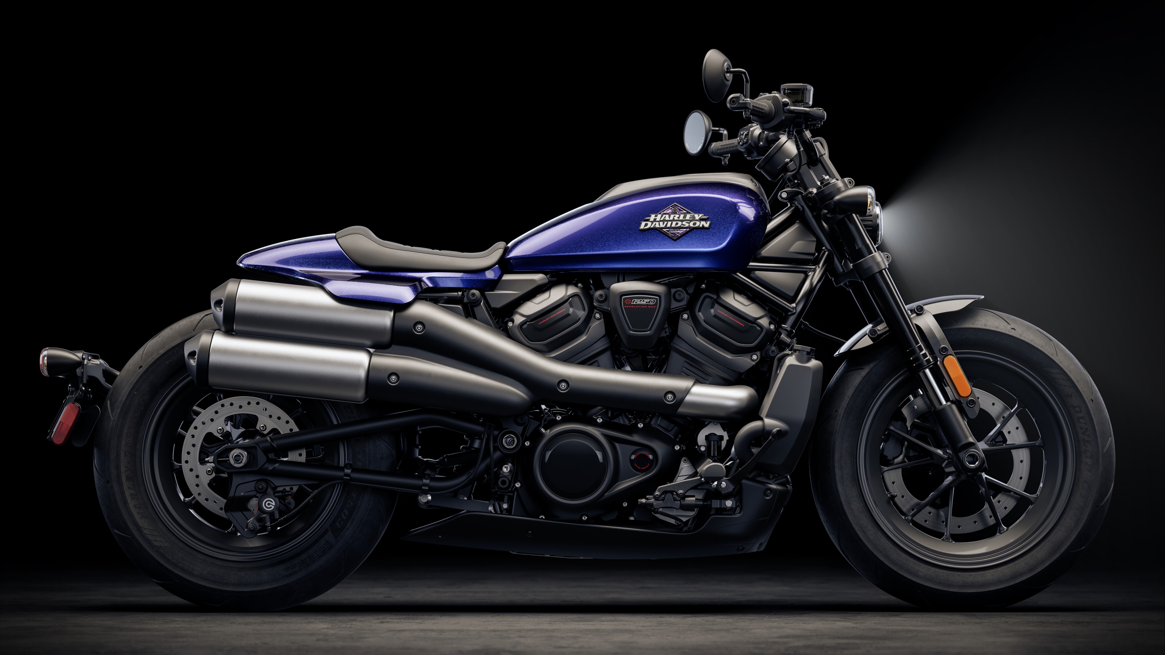 A high-detail close-up of a Harley-Davidson Sportster S motorcycle set against a dark, moody, and cinematic background.