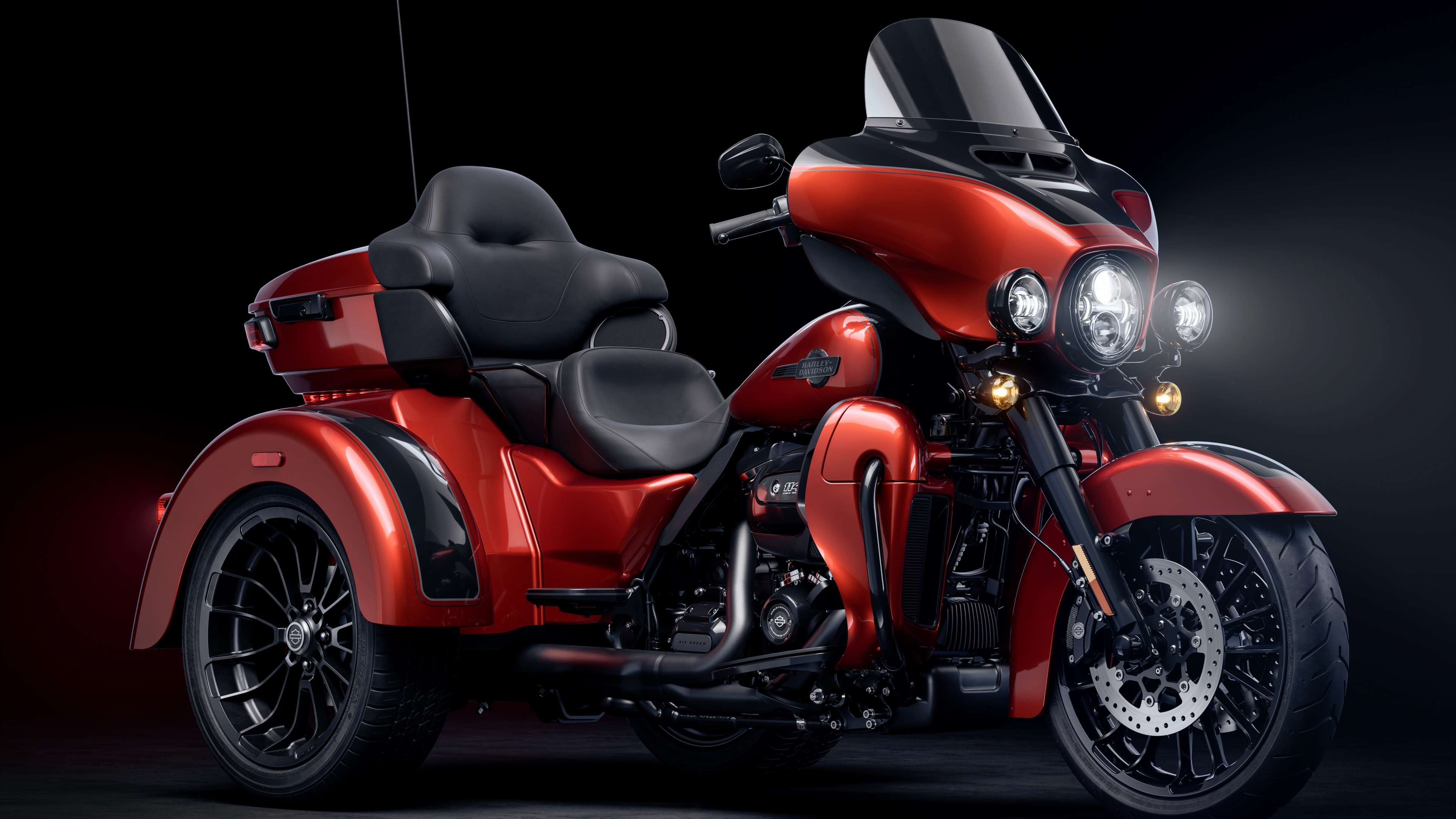 A high-detail 5K shot of a Harley-Davidson motorcycle against a dark, dramatic background highlighting its metallic textures.