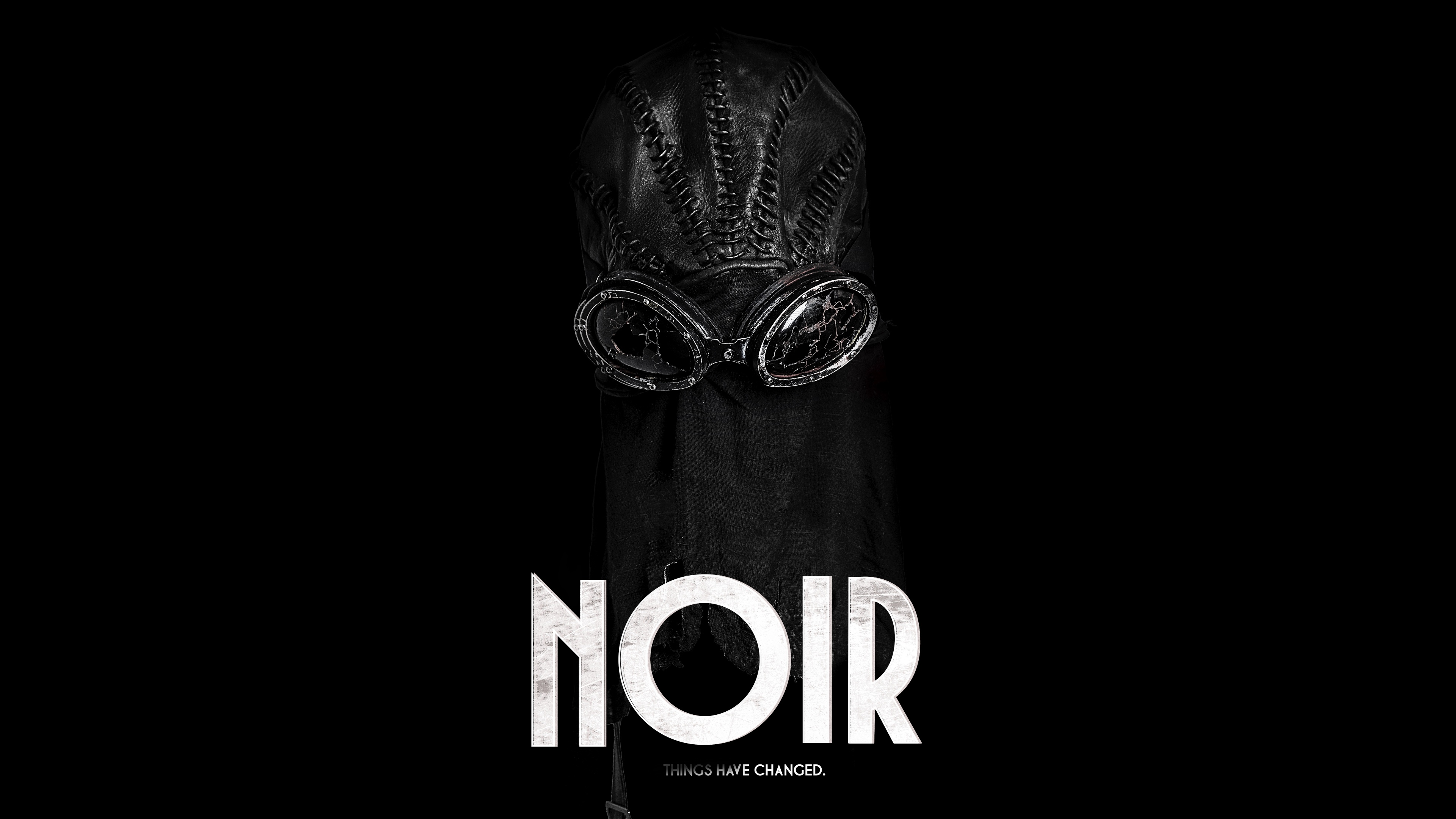 Dramatic close-up of Spider-Noir from Marvel against a pitch-black background.