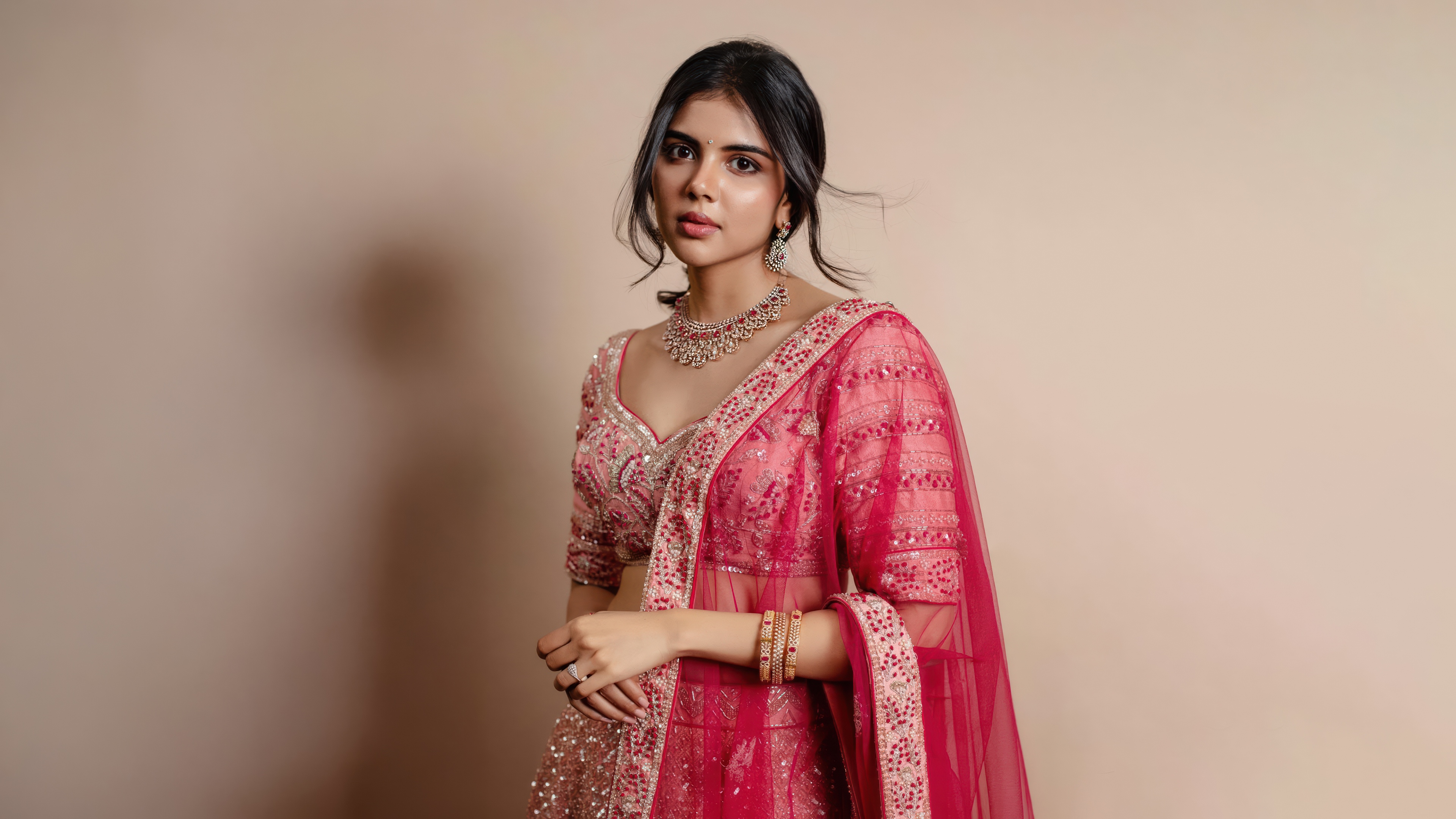 A high-resolution portrait of Indian actress Kalyani Priyadarshan wearing elegant traditional Indian ethnic clothing.