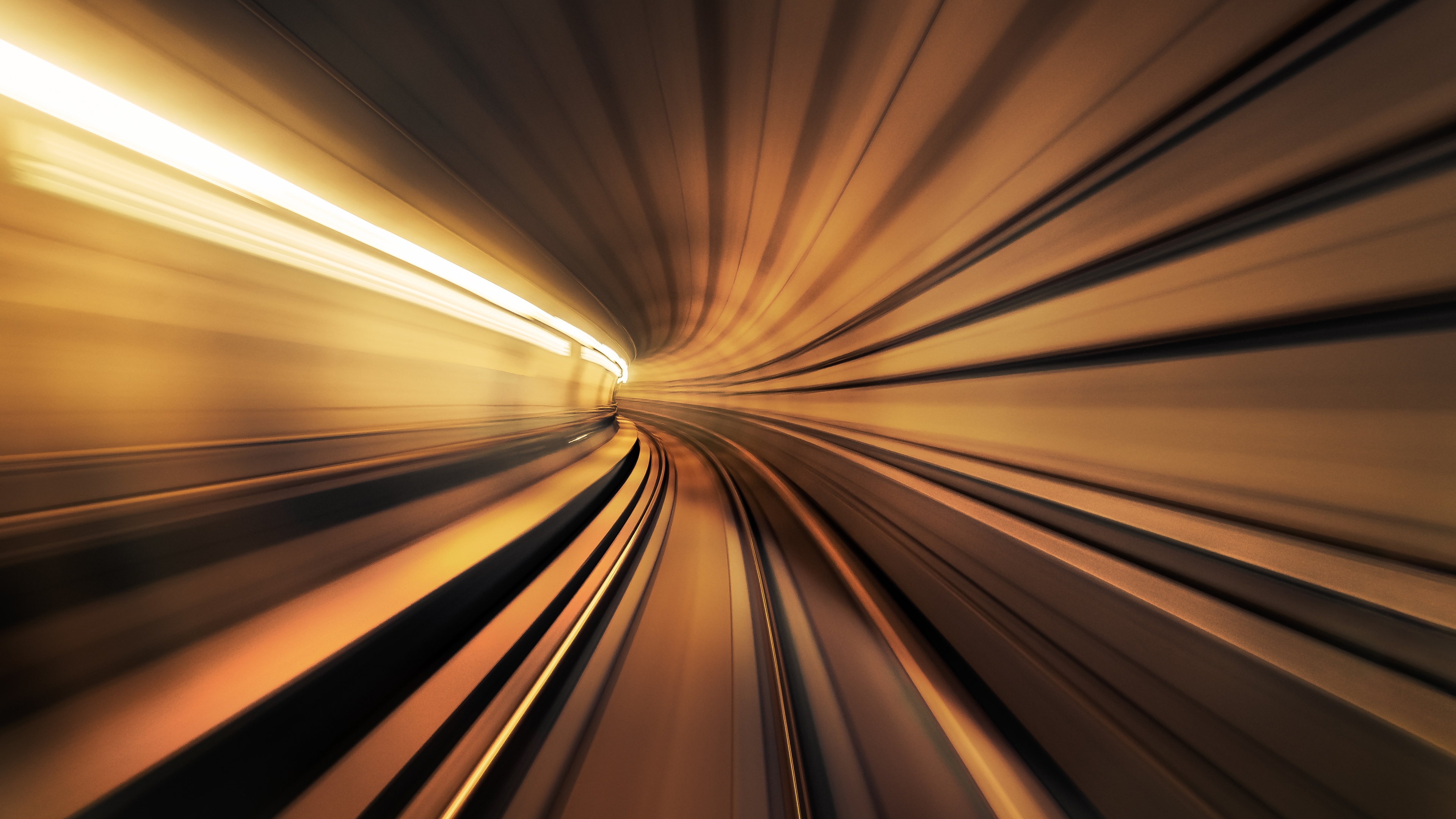 A cinematic view of a warp tunnel featuring intense motion blur and glowing light trails representing a journey through time.