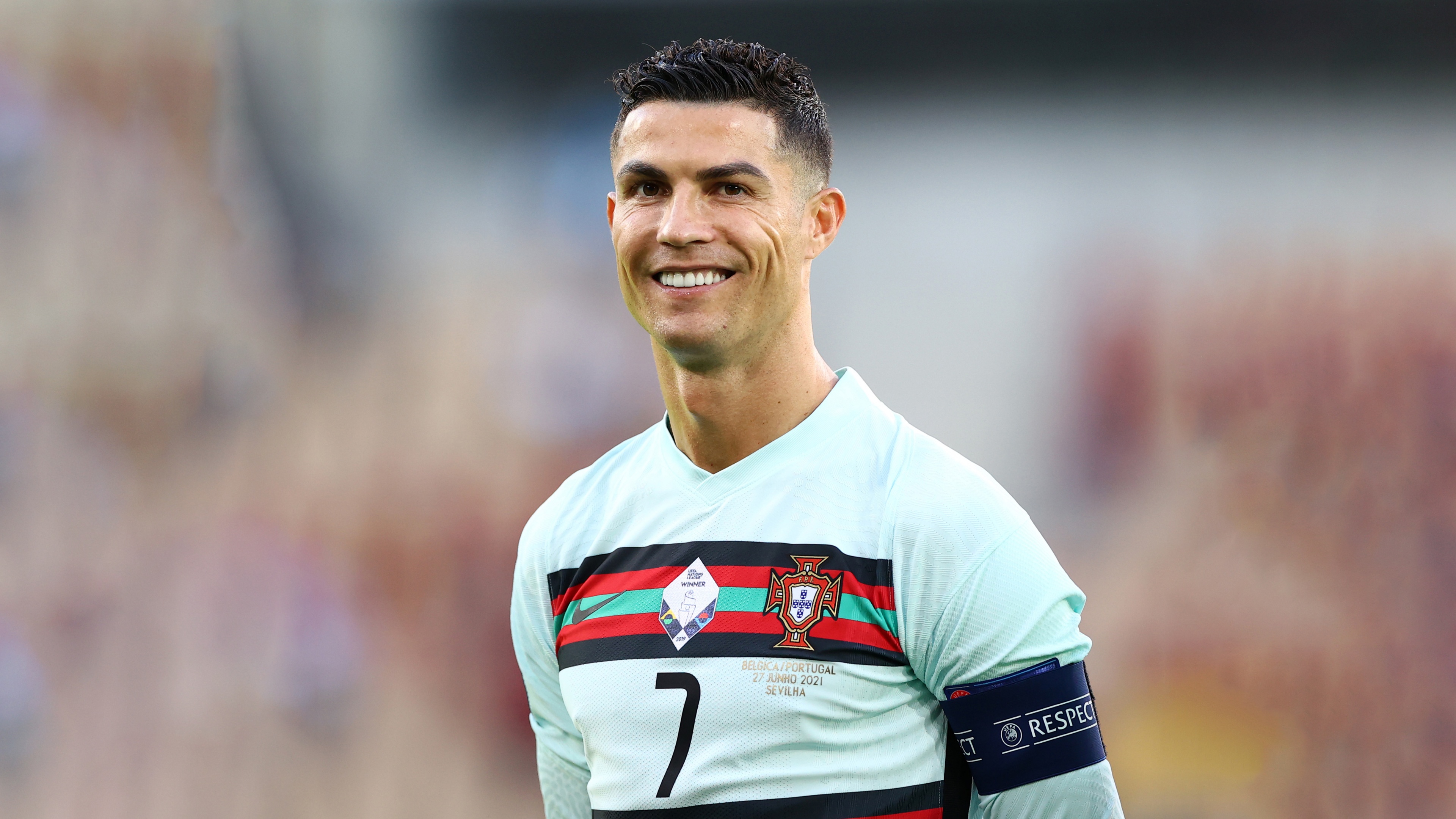 A high-quality 5K close-up portrait of Cristiano Ronaldo smiling.