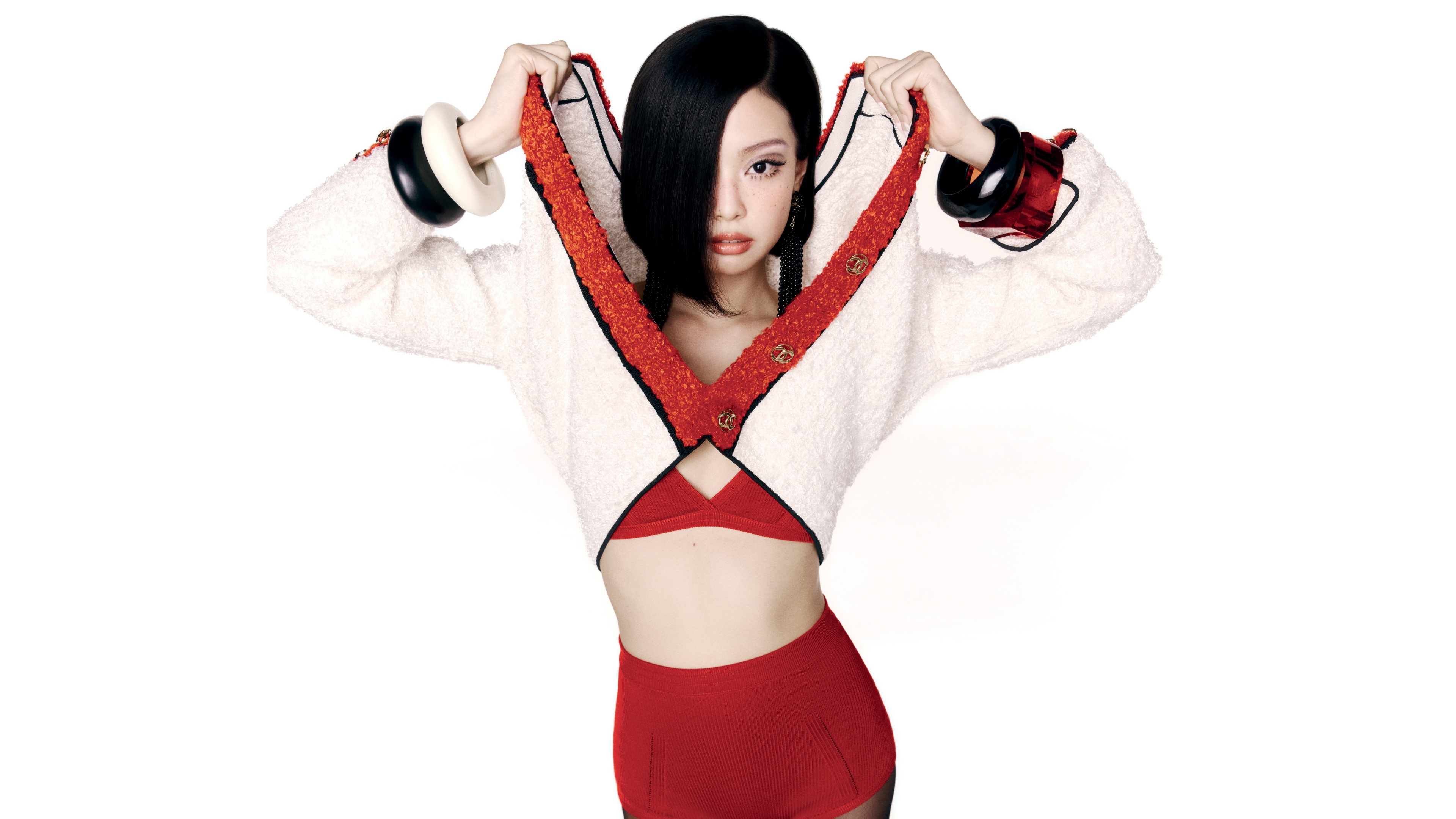 A high-resolution studio portrait of Jennie Kim against a white background, styled for V Magazine.