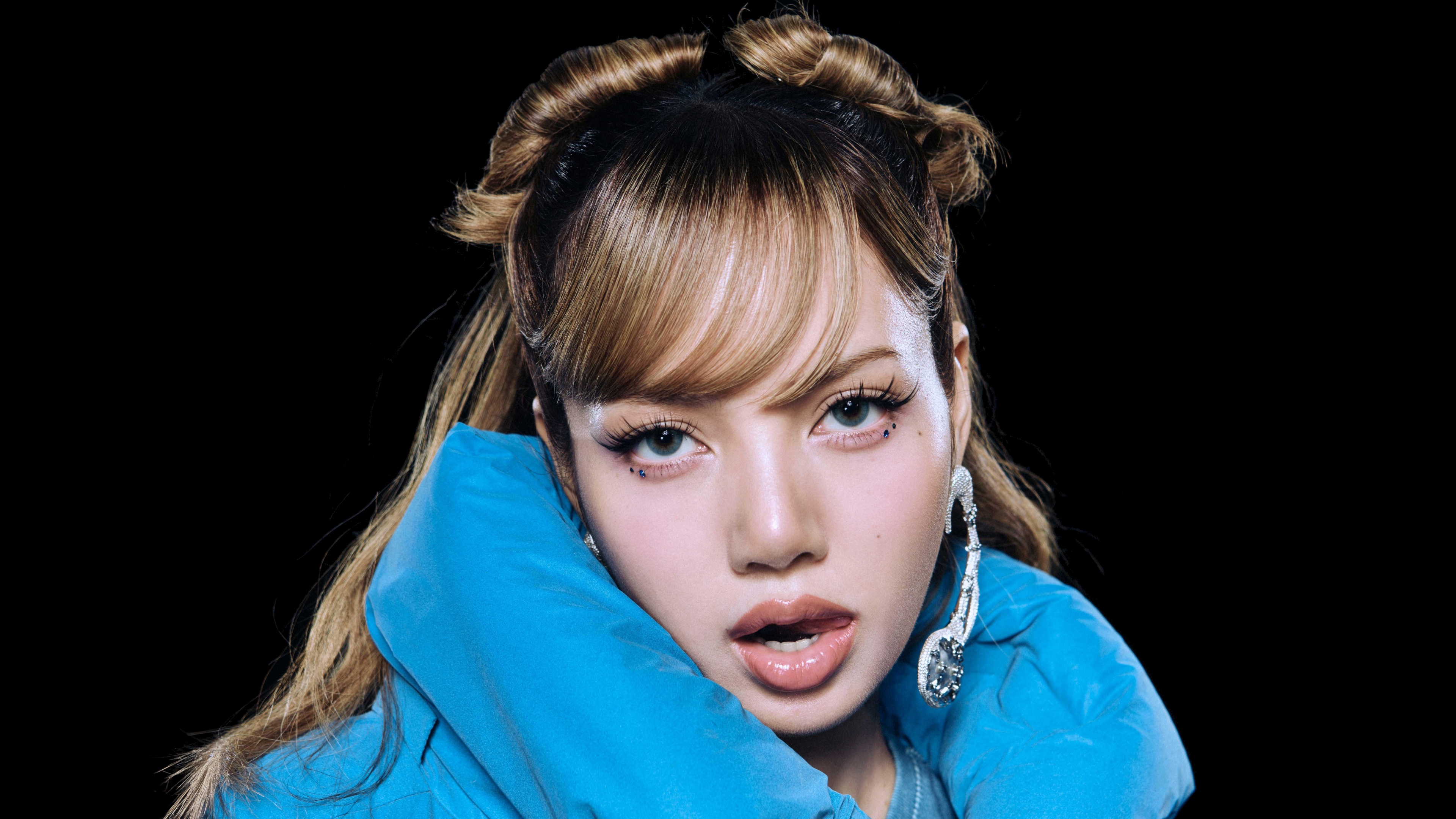 A high-resolution individual portrait of Lisa from Blackpink against a dark black background.