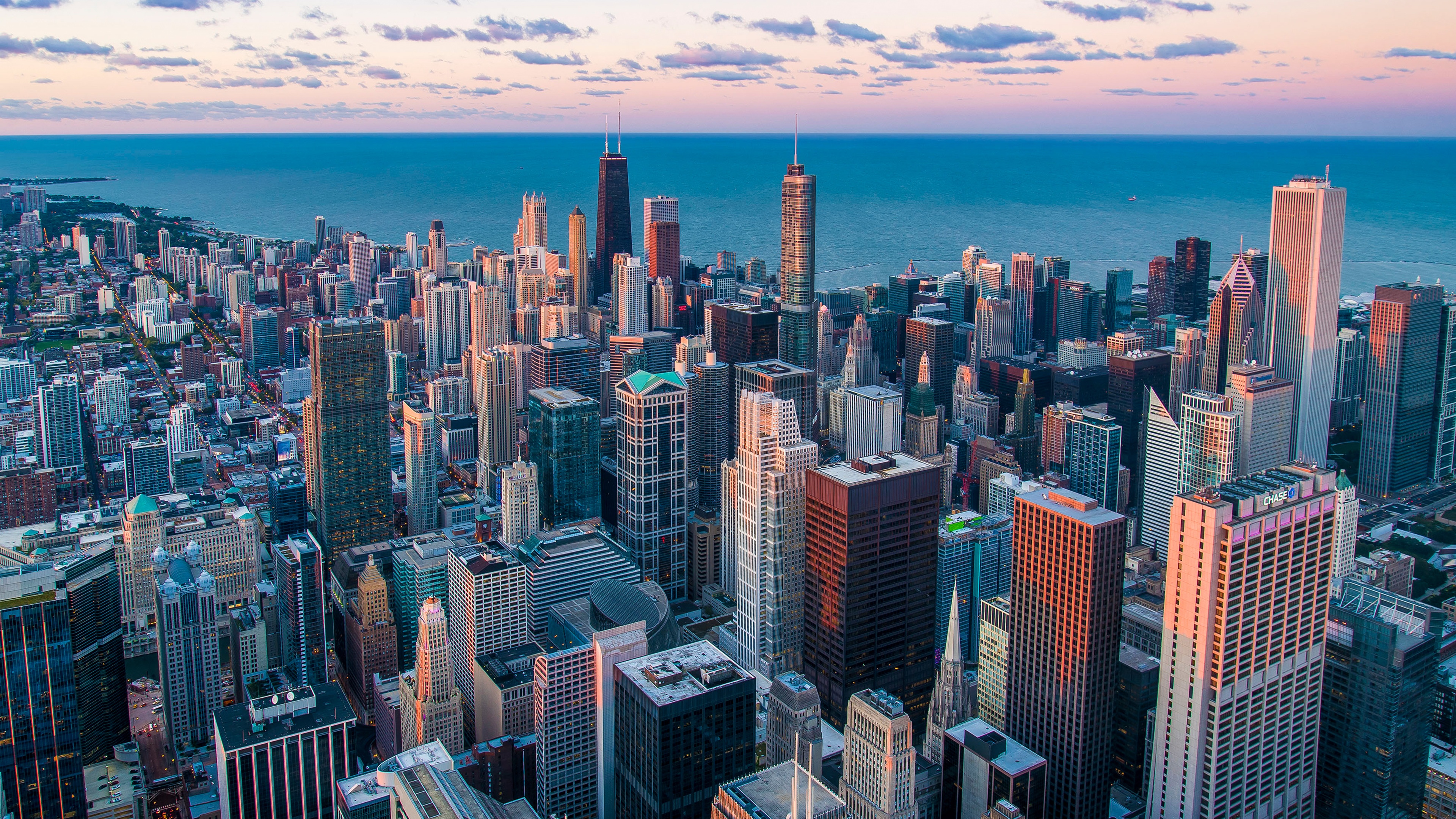 Aerial view of the Chicago skyline featuring towering skyscrapers and urban cityscape.