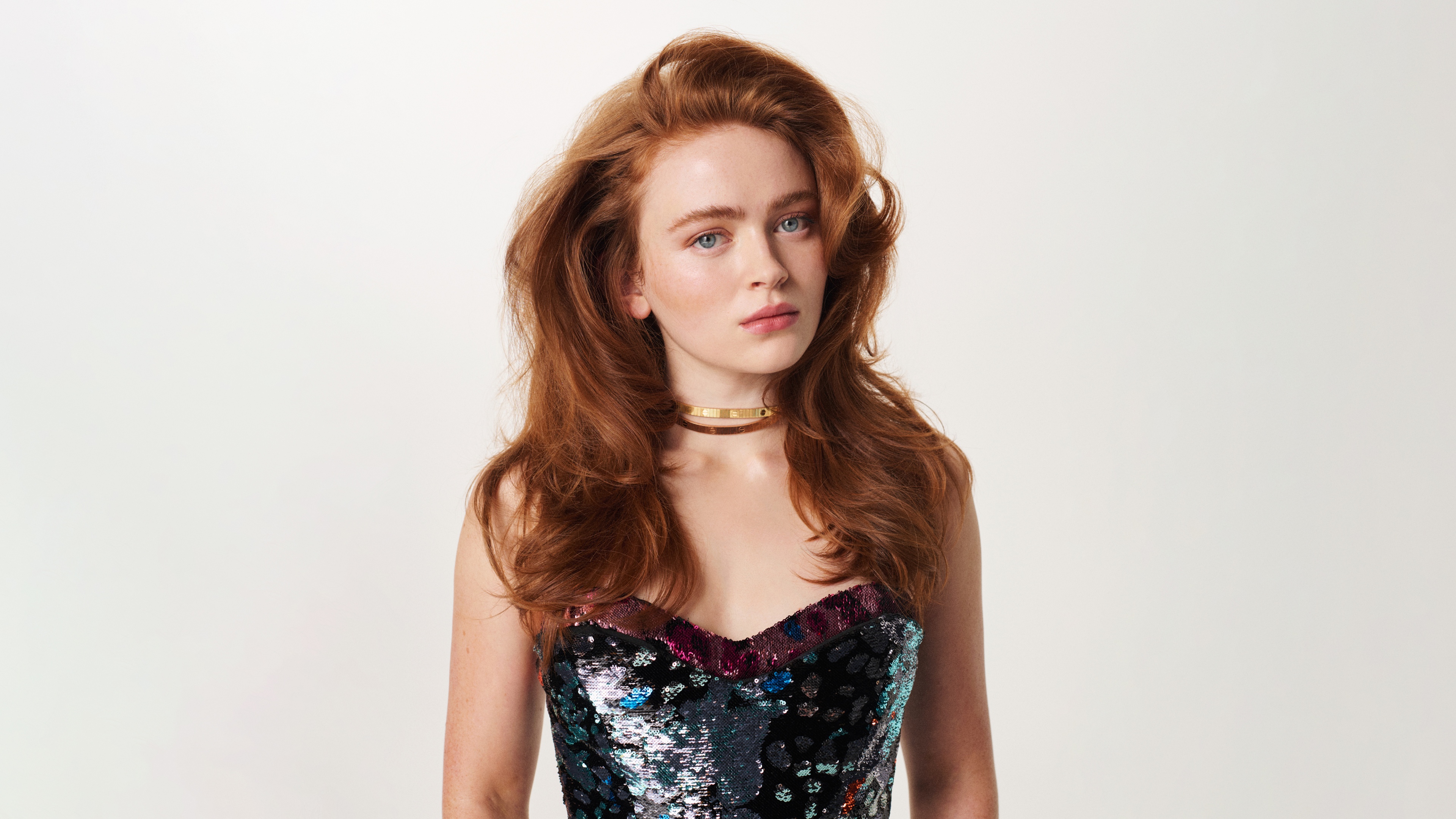 A professional 5K portrait of actress Sadie Sink against a plain white background.