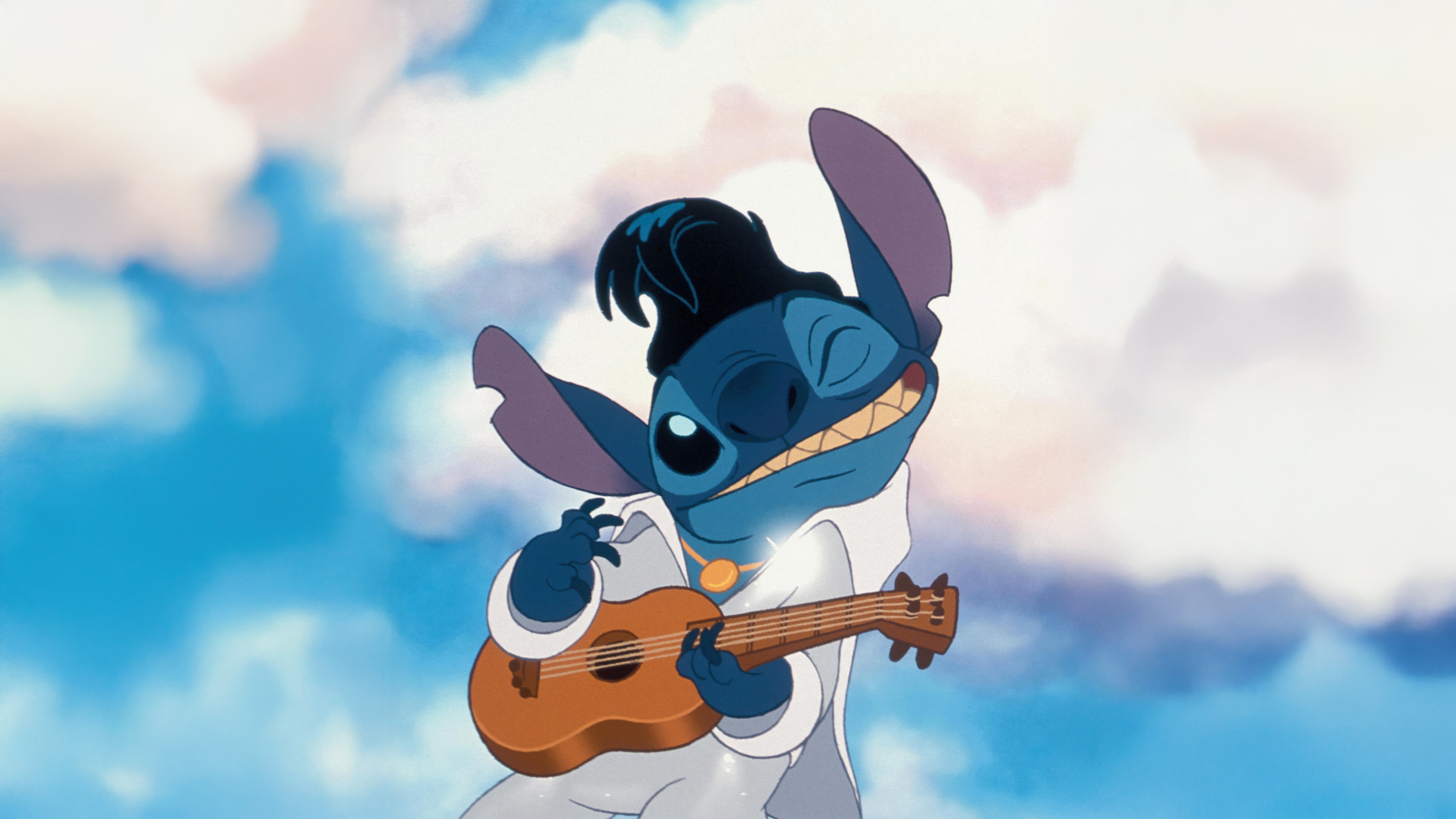 Stitch from Disney's Lilo & Stitch playing an acoustic guitar.