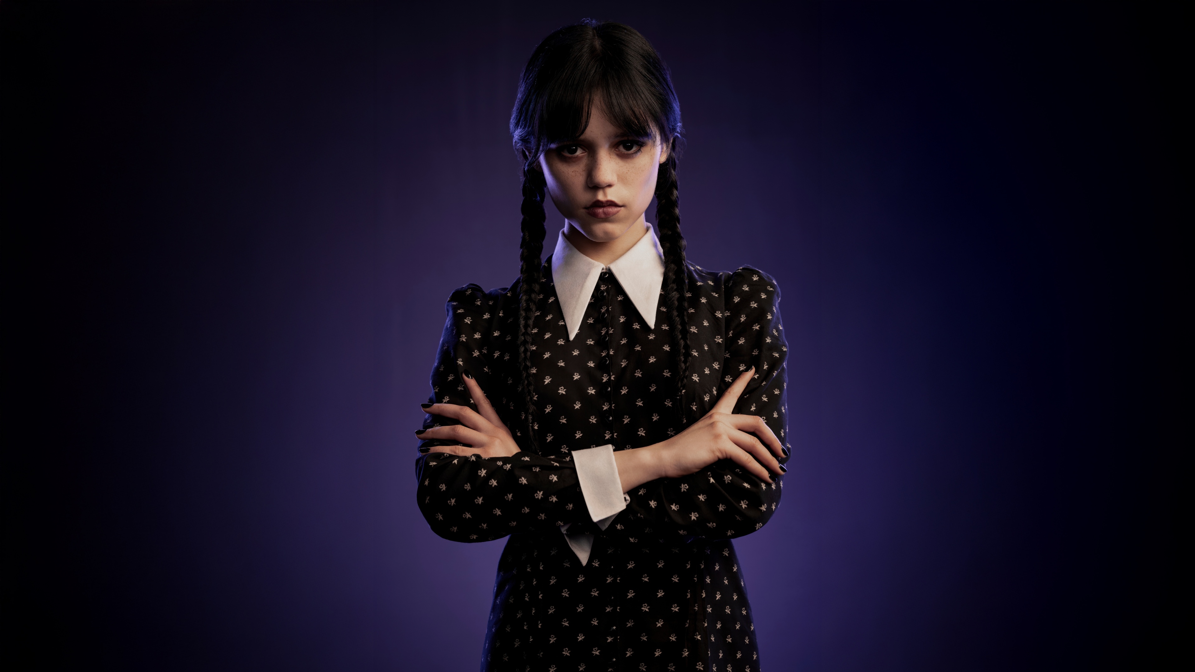 Jenna Ortega as Wednesday Addams from the Netflix series Wednesday against a dark background