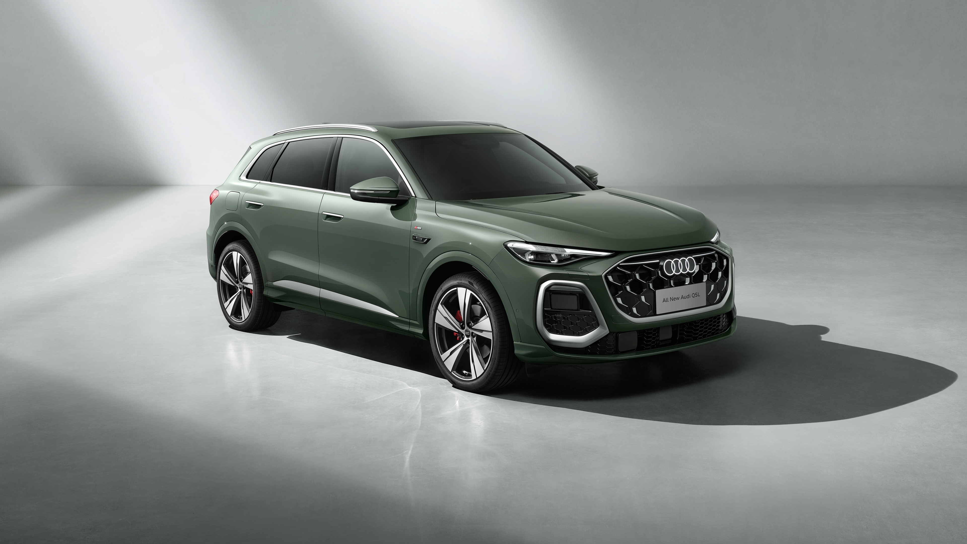 A detailed, high-resolution shot of the 2025 Audi Q5 luxury SUV, highlighting its modern front grille and advanced LED headlight design.
