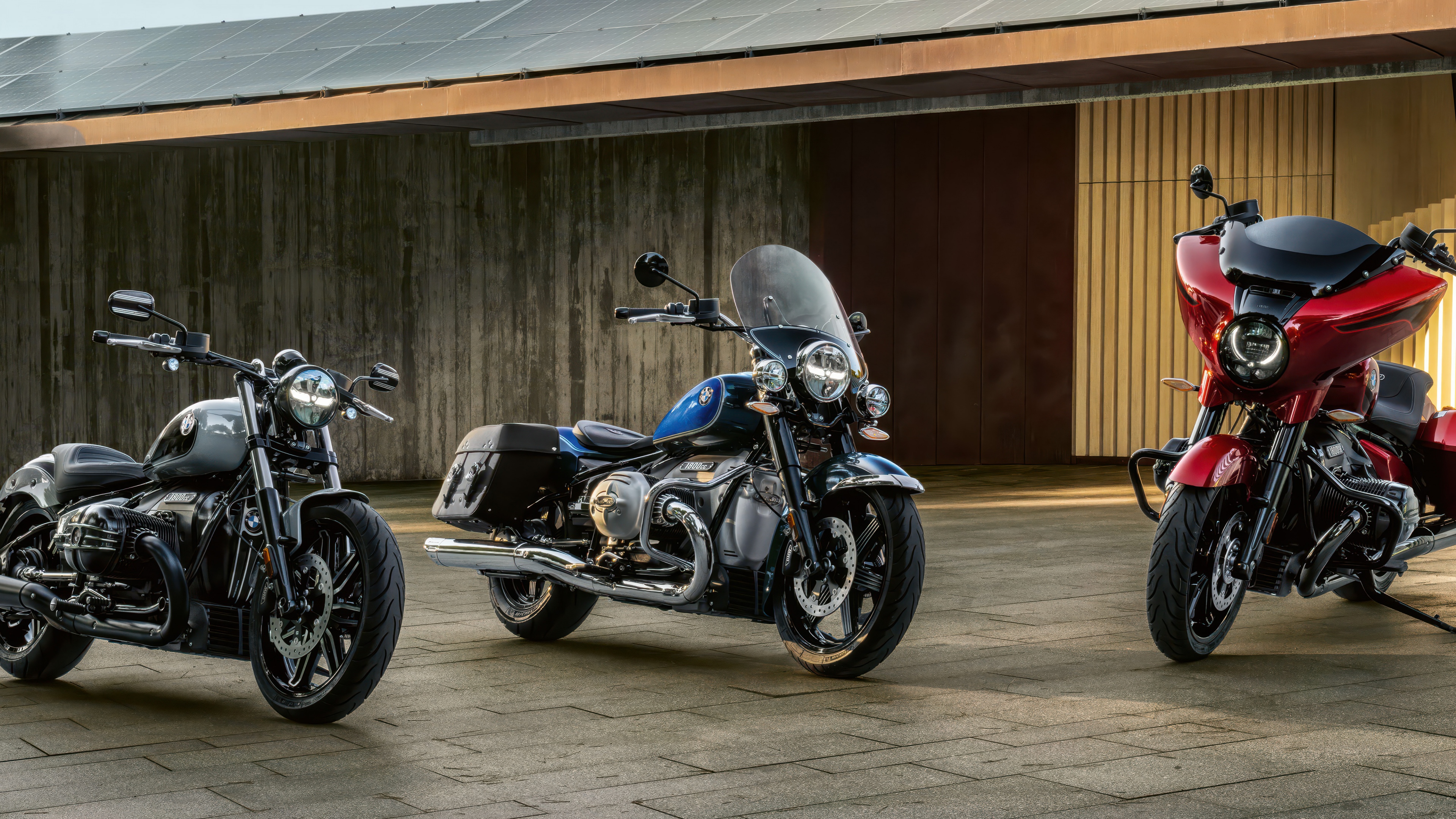 A high-resolution, wide-angle shot of the 2025 BMW R 18 motorcycle showcasing its heavy-duty cruiser design.