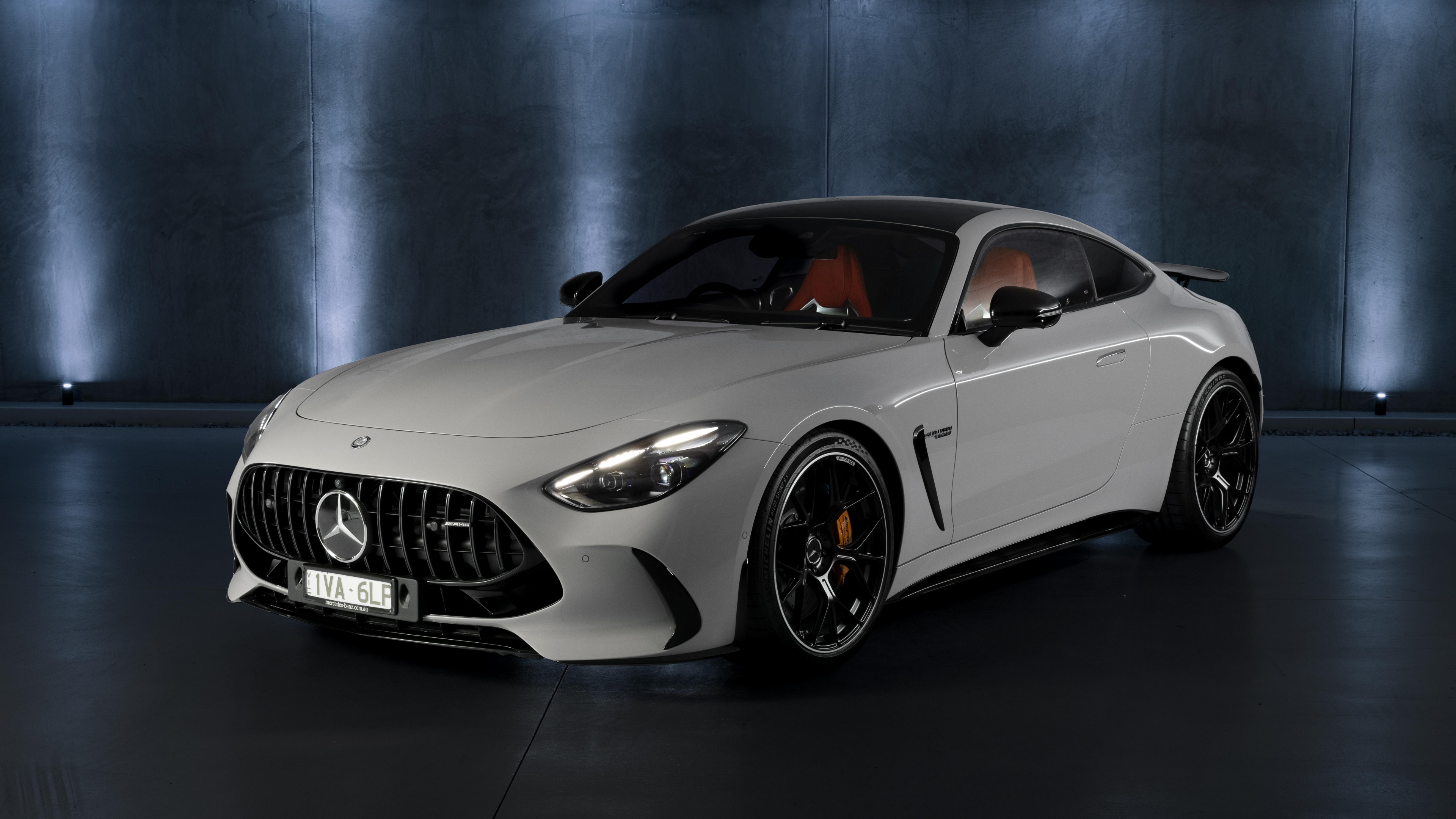 Close-up of the 2025 Mercedes-AMG GT 63 4MATIC+ featuring its advanced aerodynamic package and sleek metallic finish.