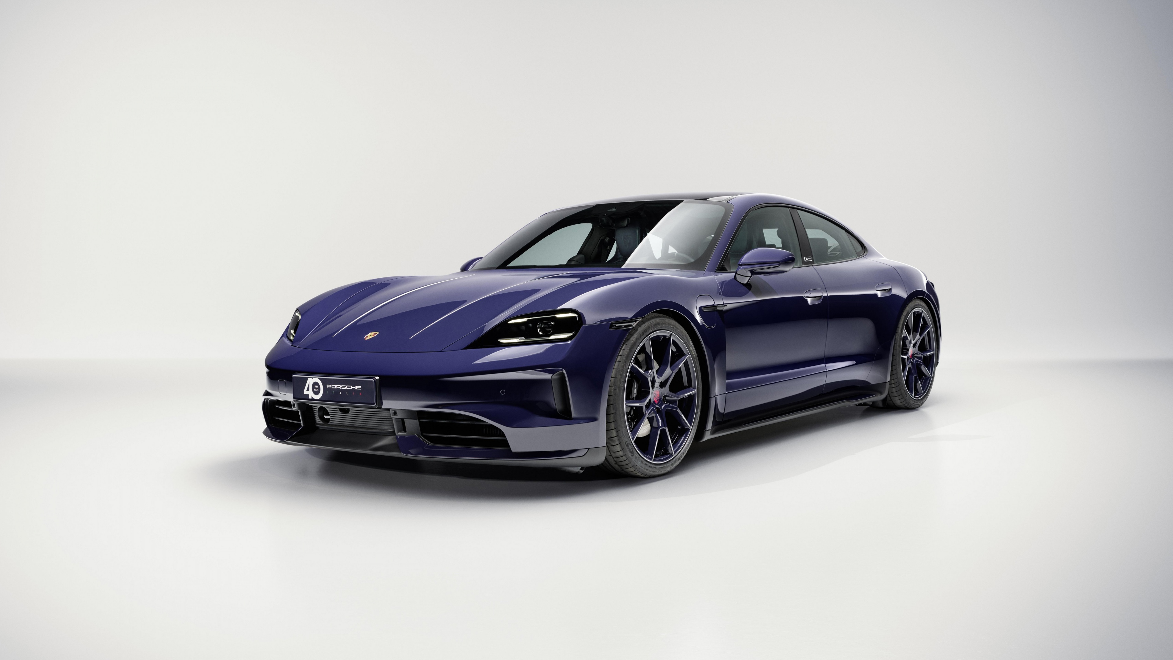 A detailed 5K high-resolution view of the 2025 Porsche Taycan 4S electric sports car.