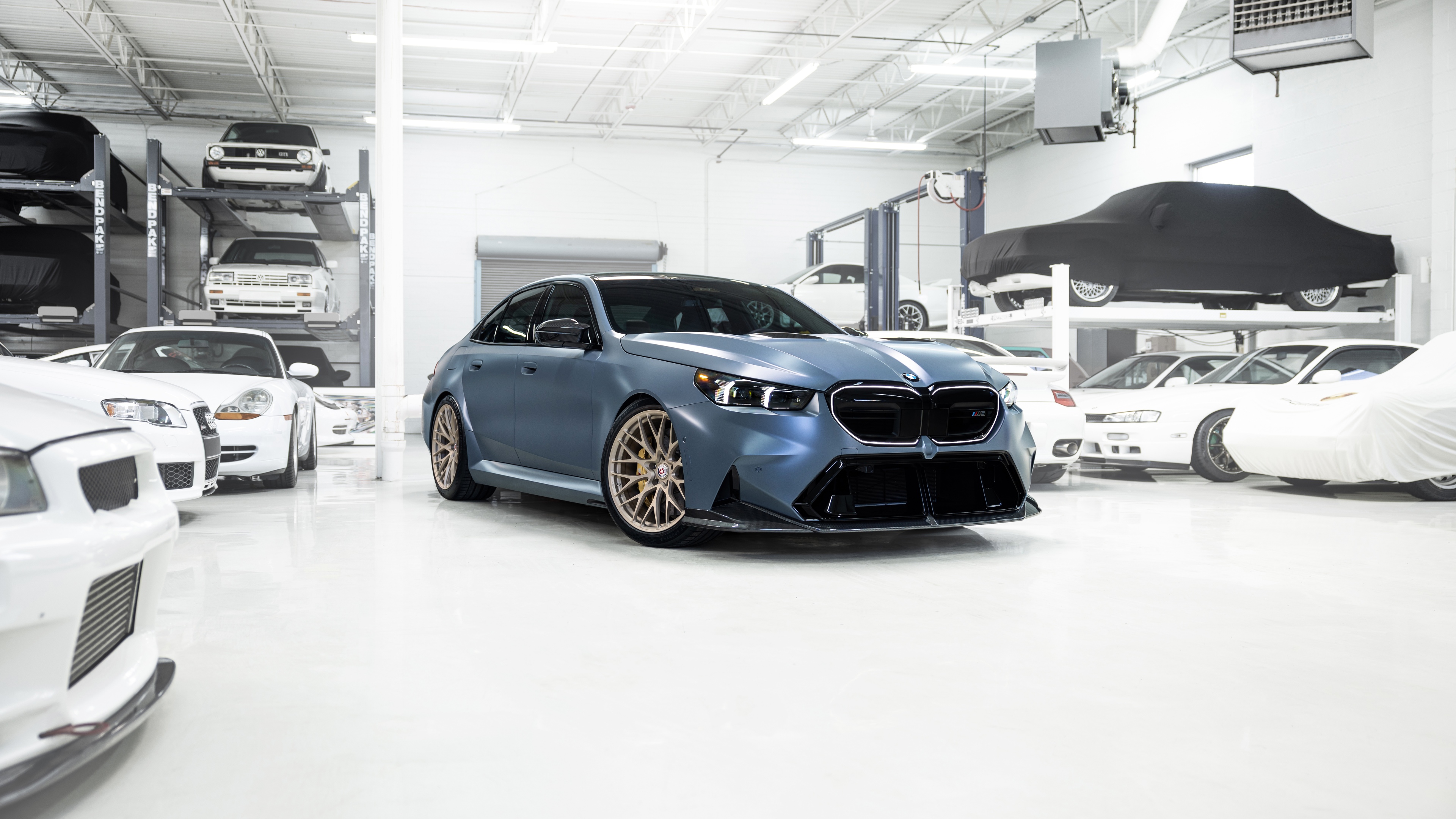 A high-detail, cinematic shot of a BMW M5 luxury sedan showcasing its sleek metallic finish and powerful automotive design.