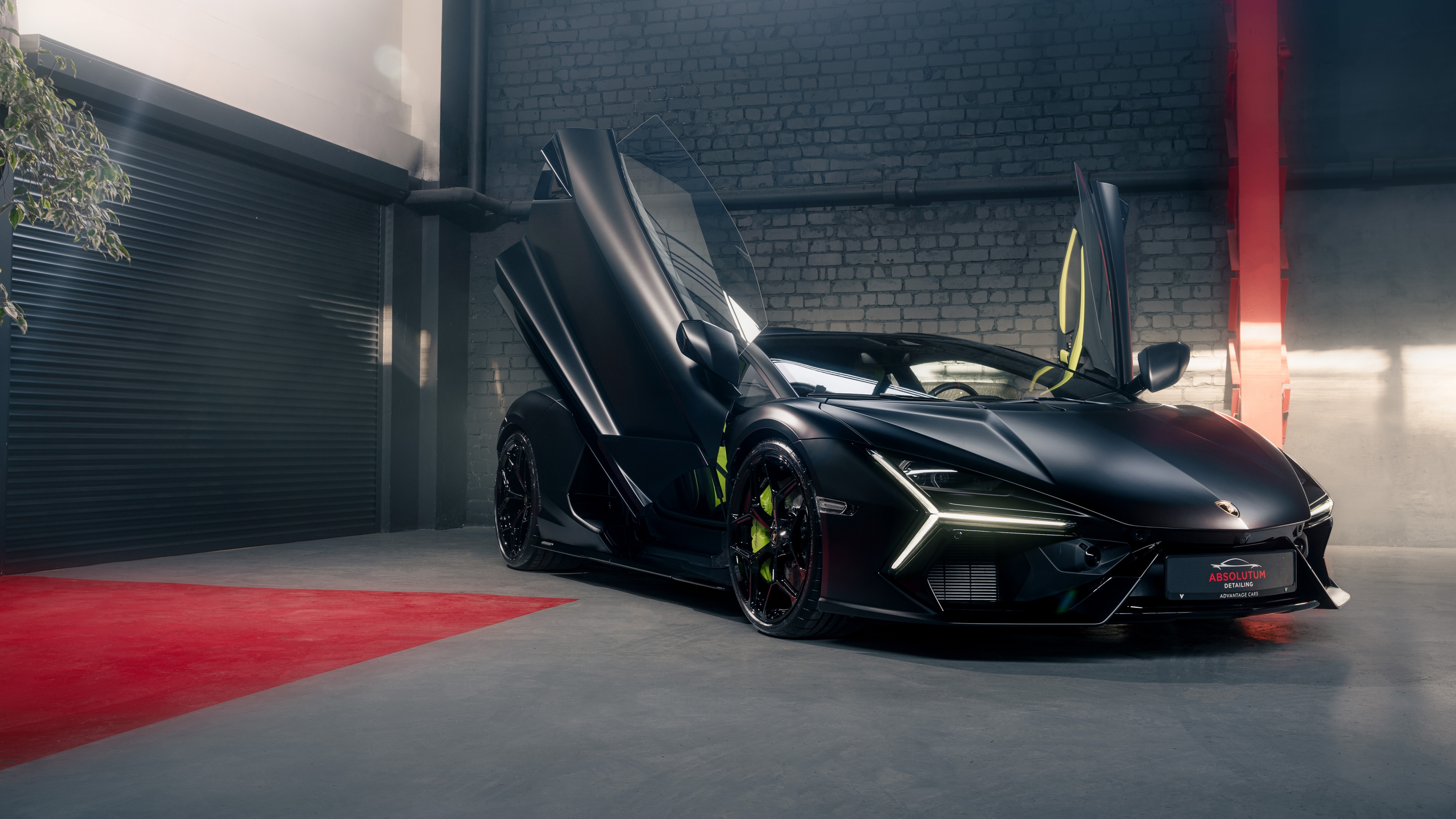 A sleek matte black Lamborghini Revuelto hybrid sports car shown in high detail.