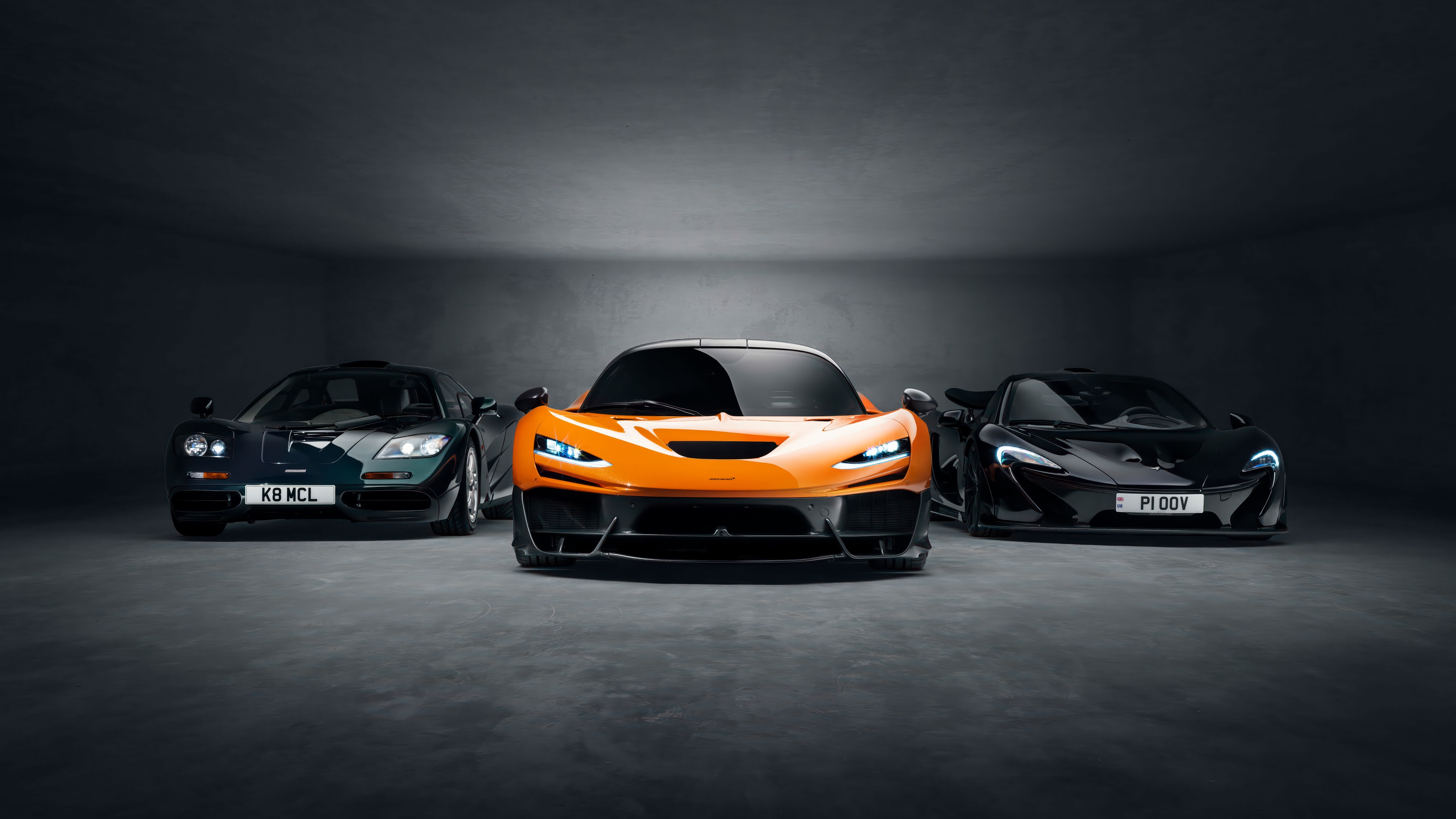 A cinematic collection of McLaren supercars, showcasing the F1, P1, and W1 models against a dark, minimalist background.