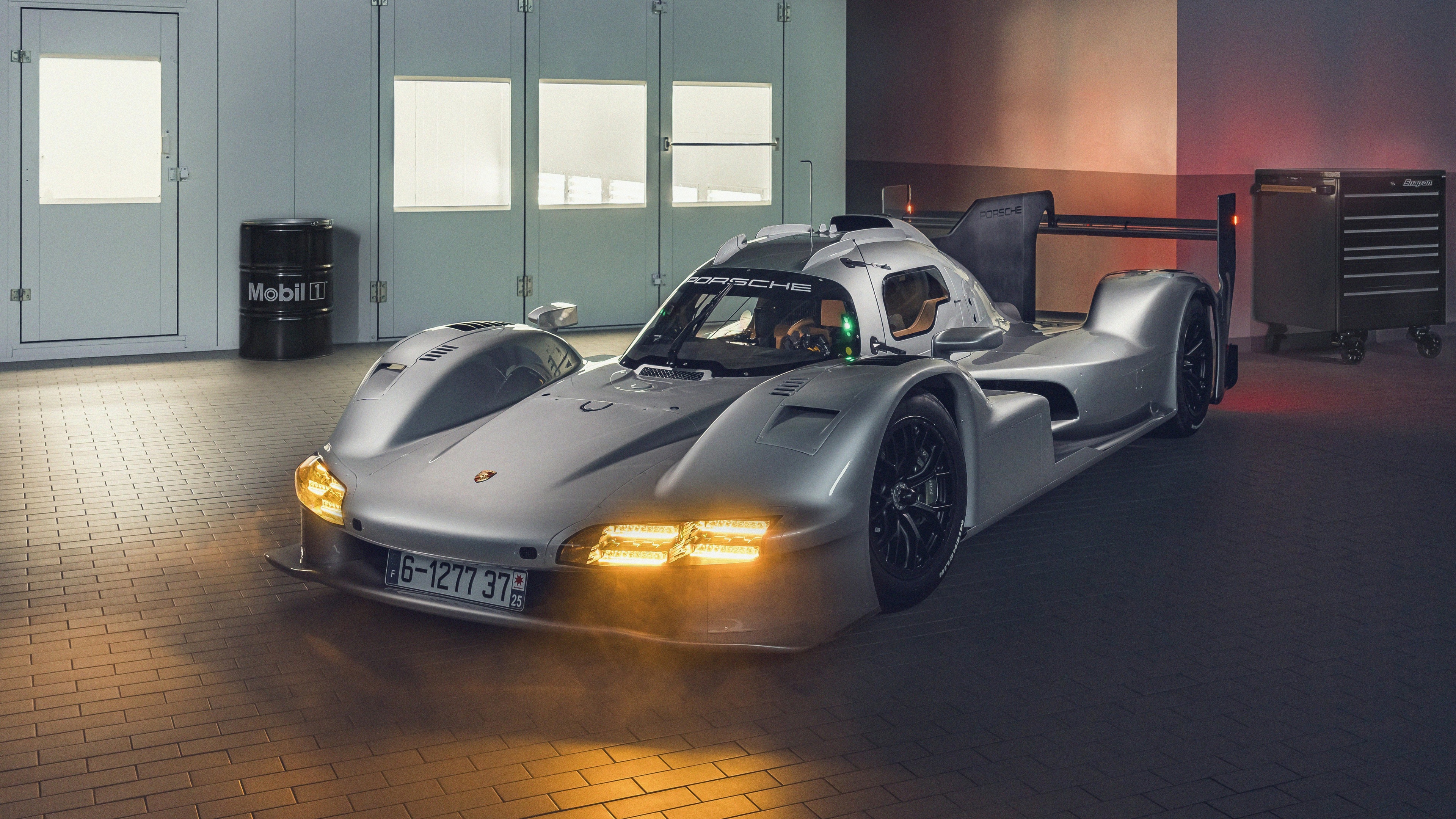 A close-up, high-detail shot of the Porsche 963 LMDh Prototype racing car.
