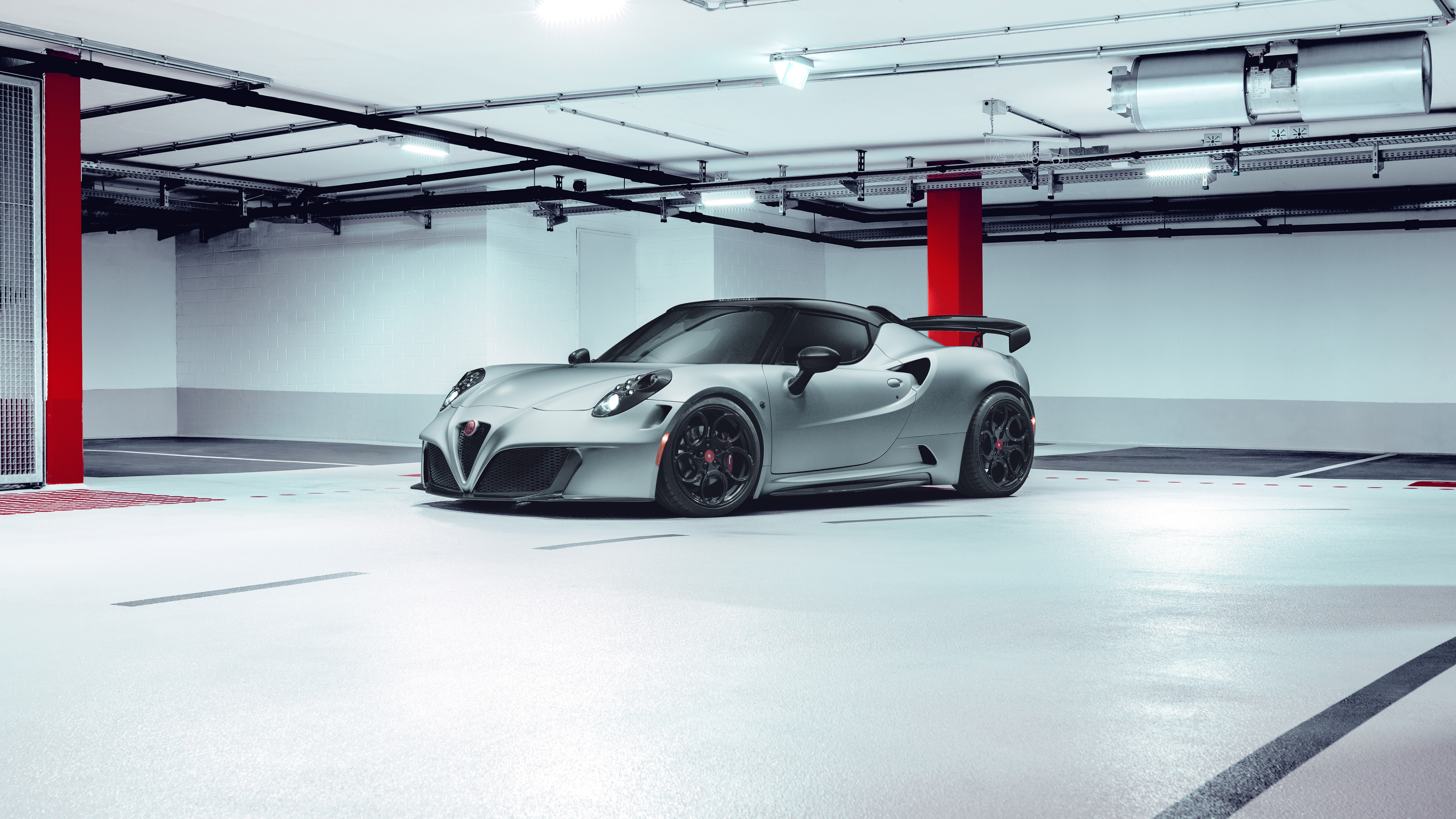 A close-up view of a sleek Alfa Romeo 4C sports car highlighting its aerodynamic curves and Italian automotive engineering.