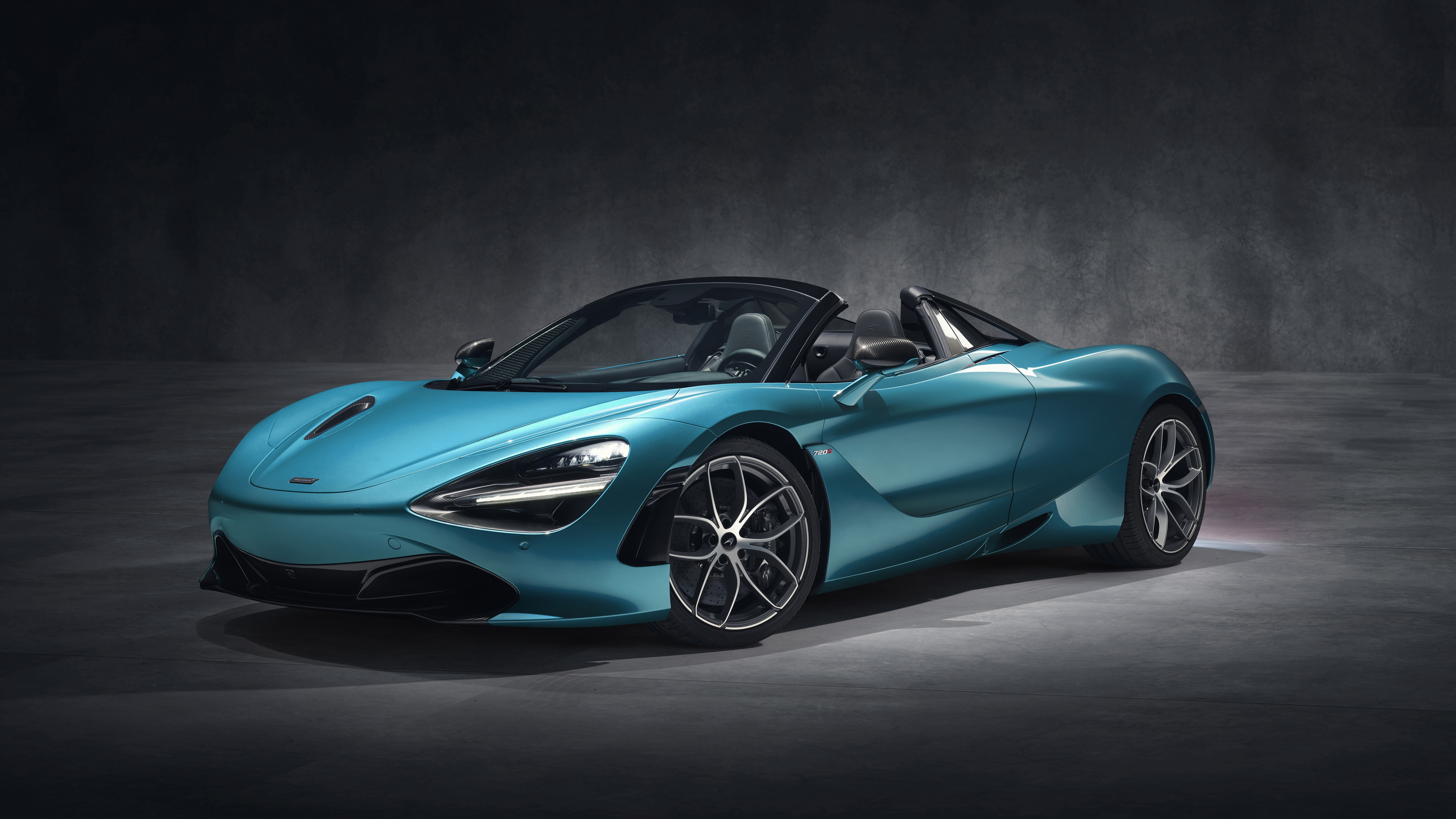 A detailed view of a high-performance McLaren 720S supercar, highlighting its aerodynamic curves and modern automotive design.