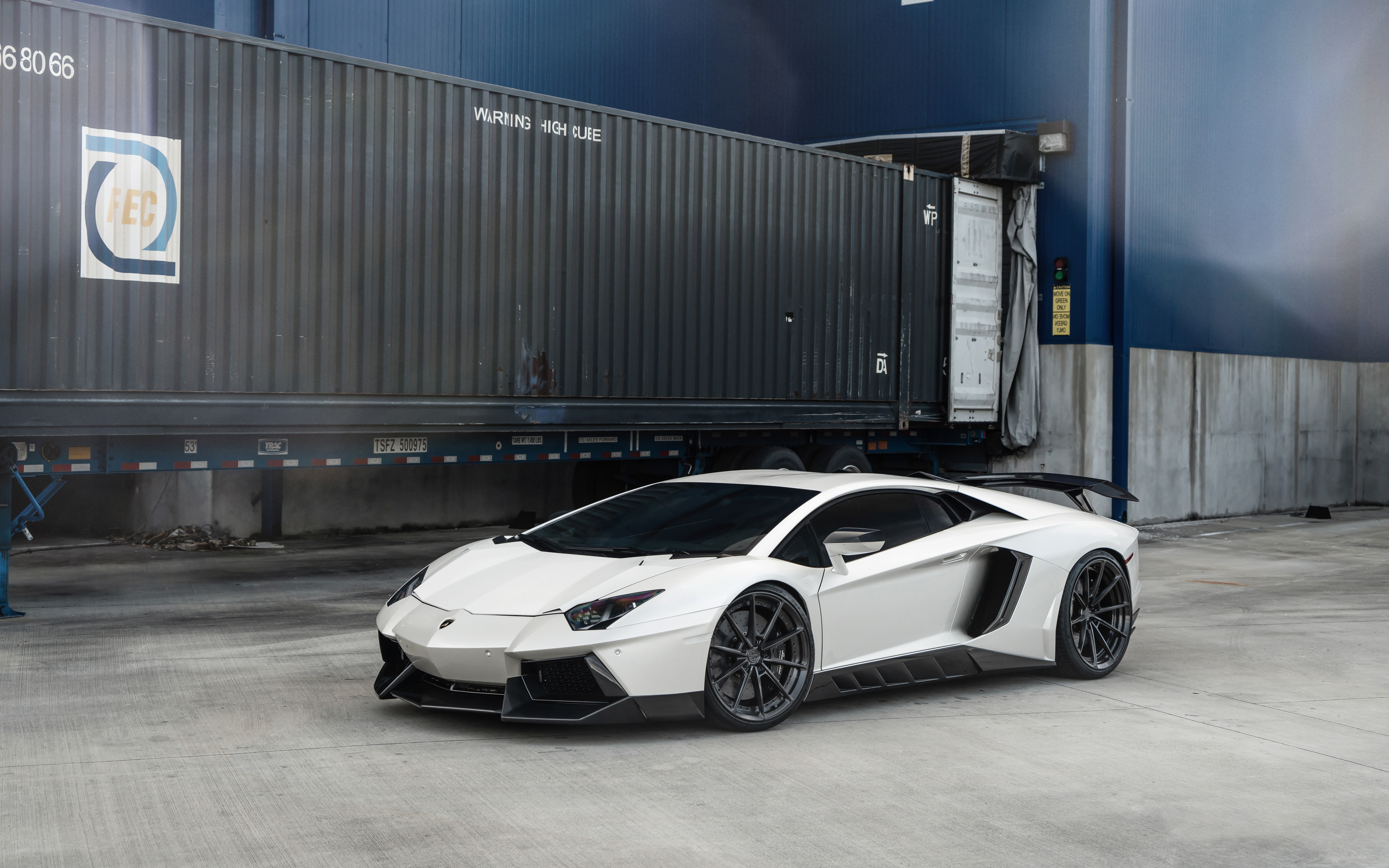 A high-performance white Lamborghini Aventador supercar with a polished finish.