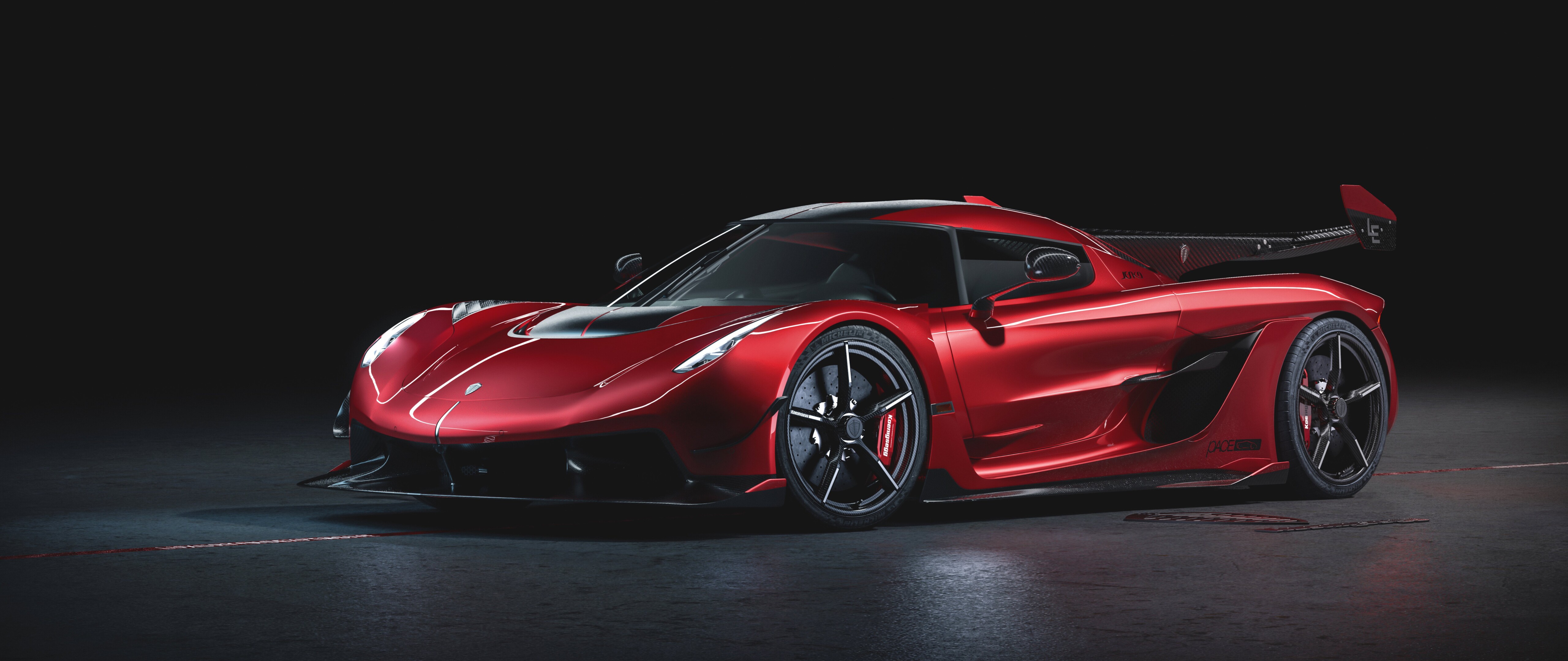 Un’immagine ravvicinata e dettagliata di una Koenigsegg Jesko, che mette in risalto il suo design futuristico e le caratteristiche aerodinamiche ad alte prestazioni.