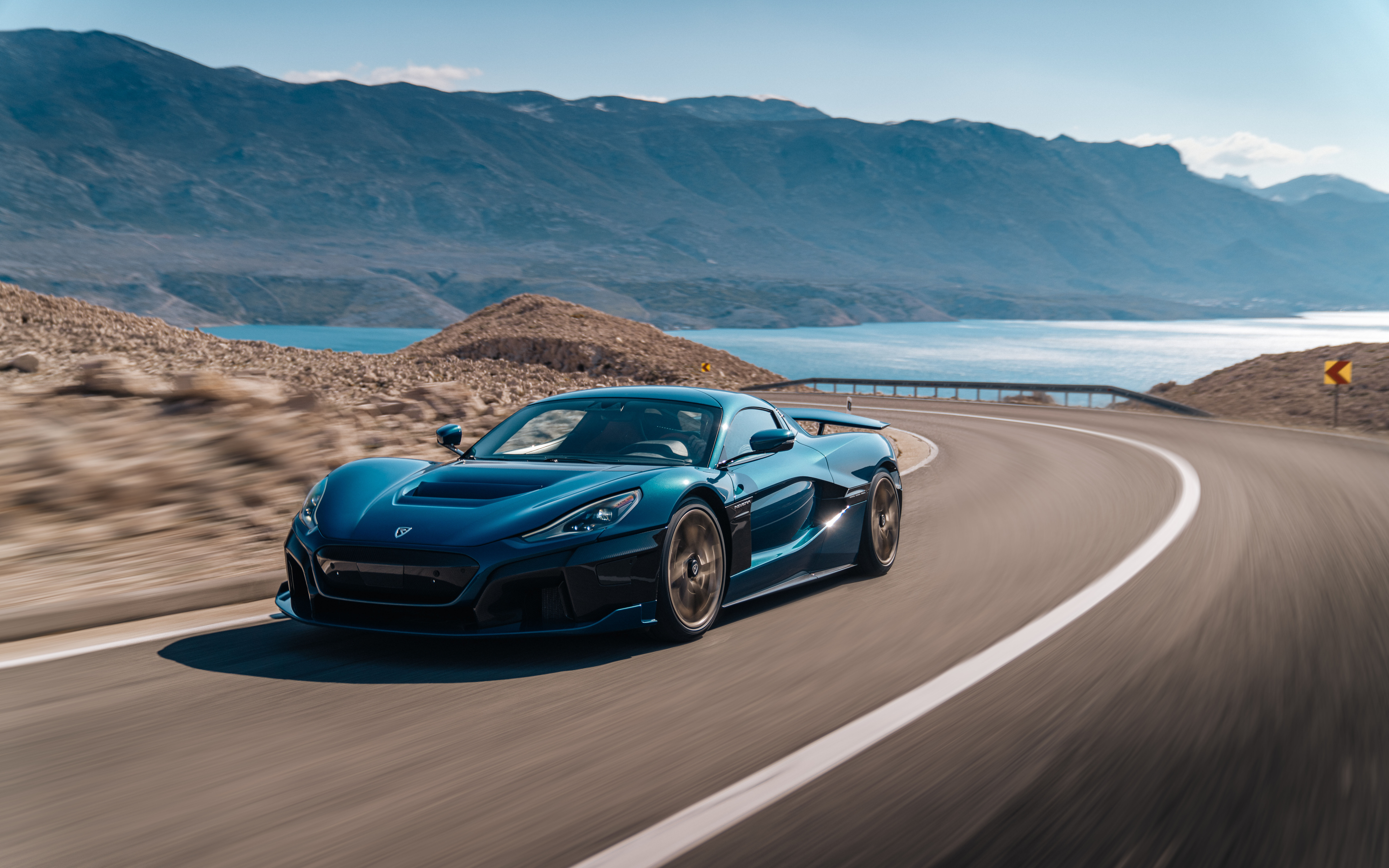 A high-performance Rimac Nevera electric supercar featuring a sleek, aerodynamic body and modern automotive design.