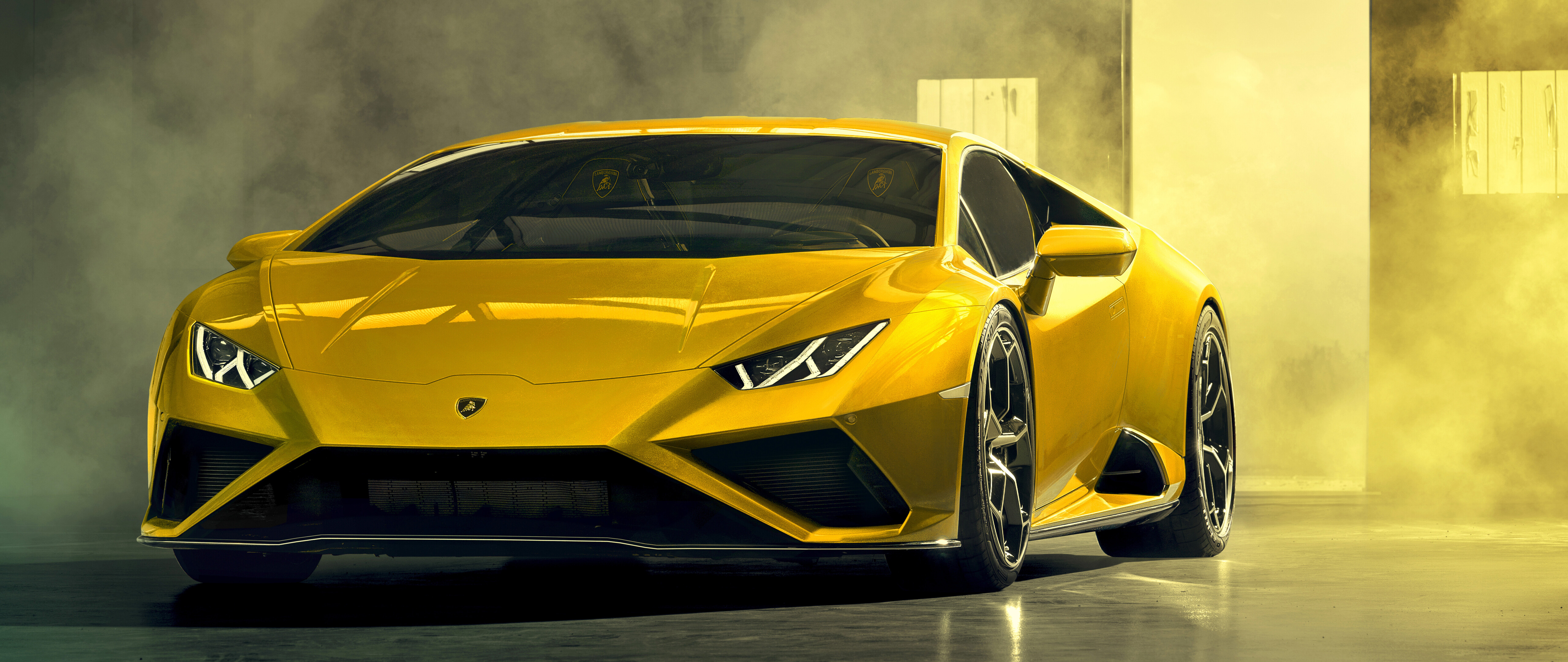 A bright yellow Lamborghini Huracán Evo supercar showcasing its aerodynamic curves and luxury design.