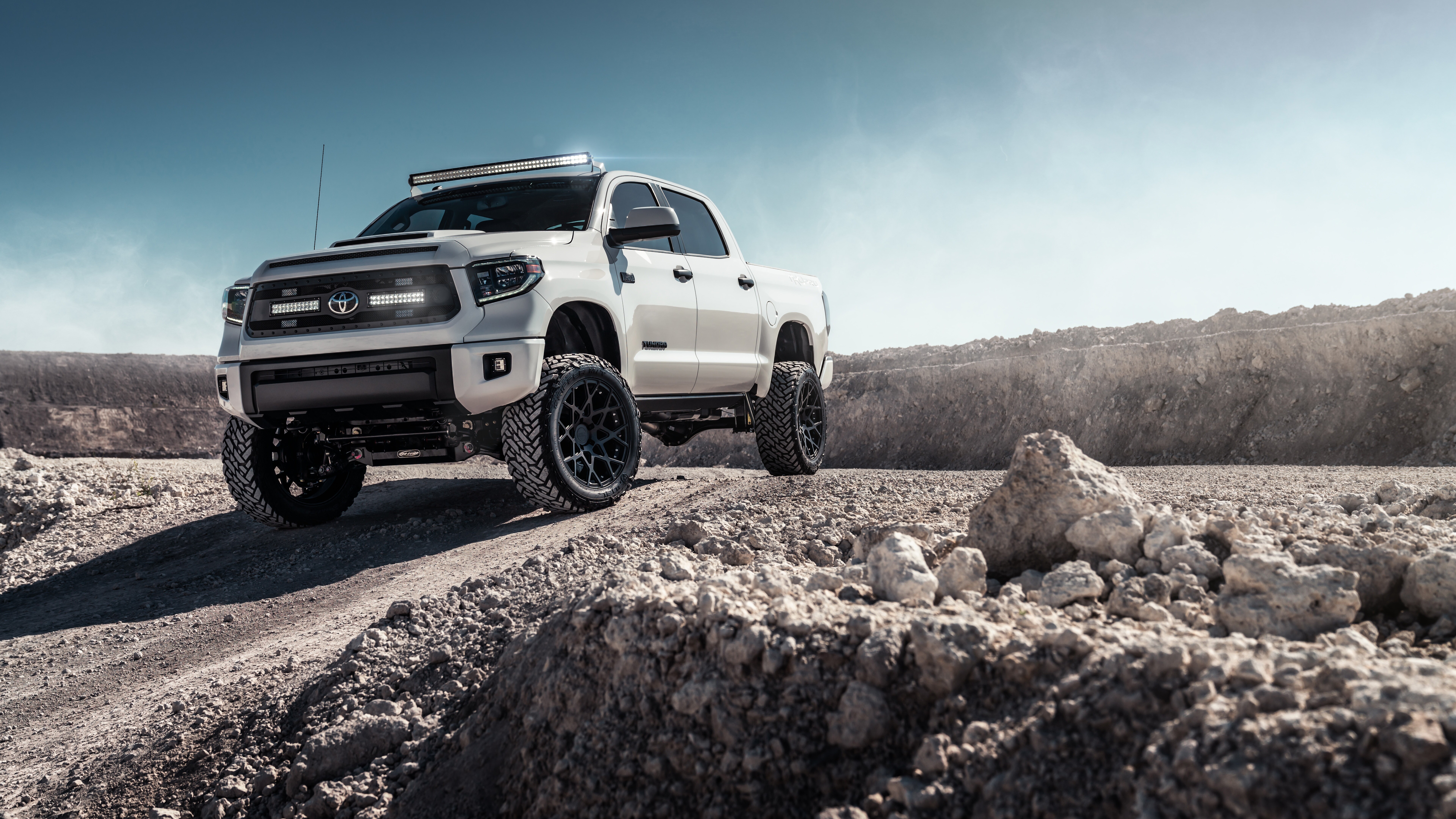 A high-resolution view of a white Toyota Tundra vehicle.