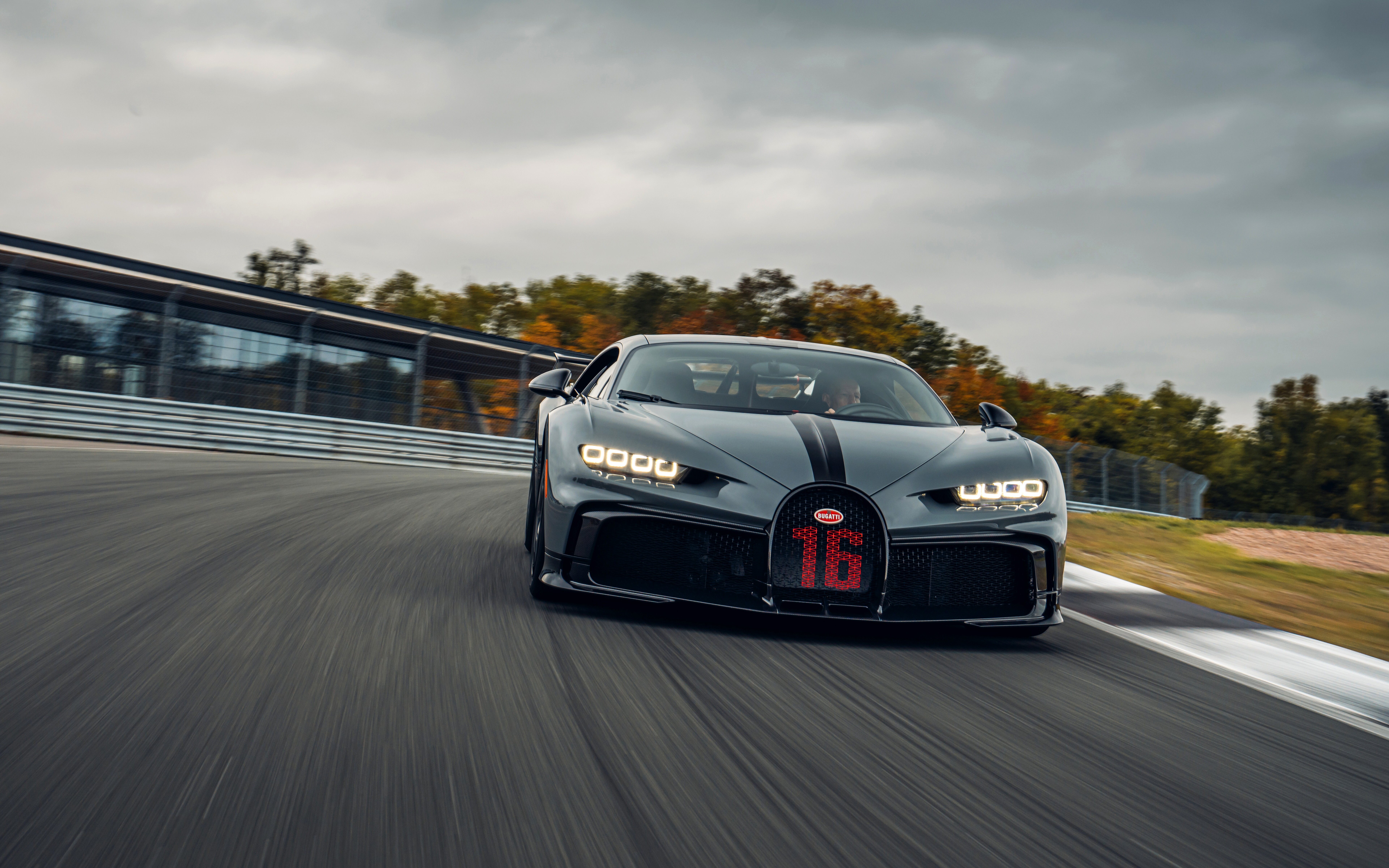 A close-up view of a Bugatti Chiron Pur Sport, featuring its sleek aerodynamic body and luxury supercar styling.