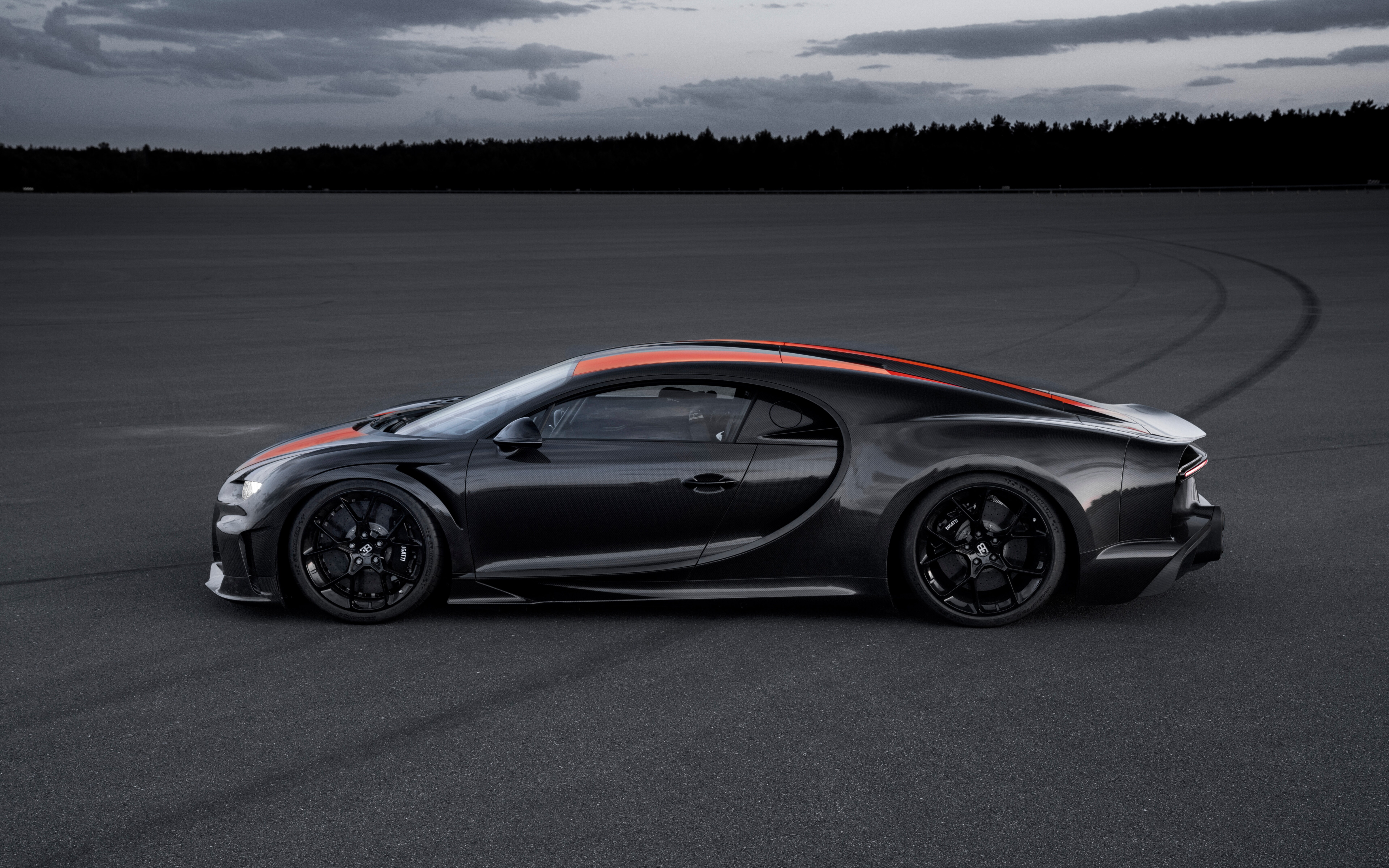 A close-up shot of a black Bugatti Chiron supercar with a glossy finish.