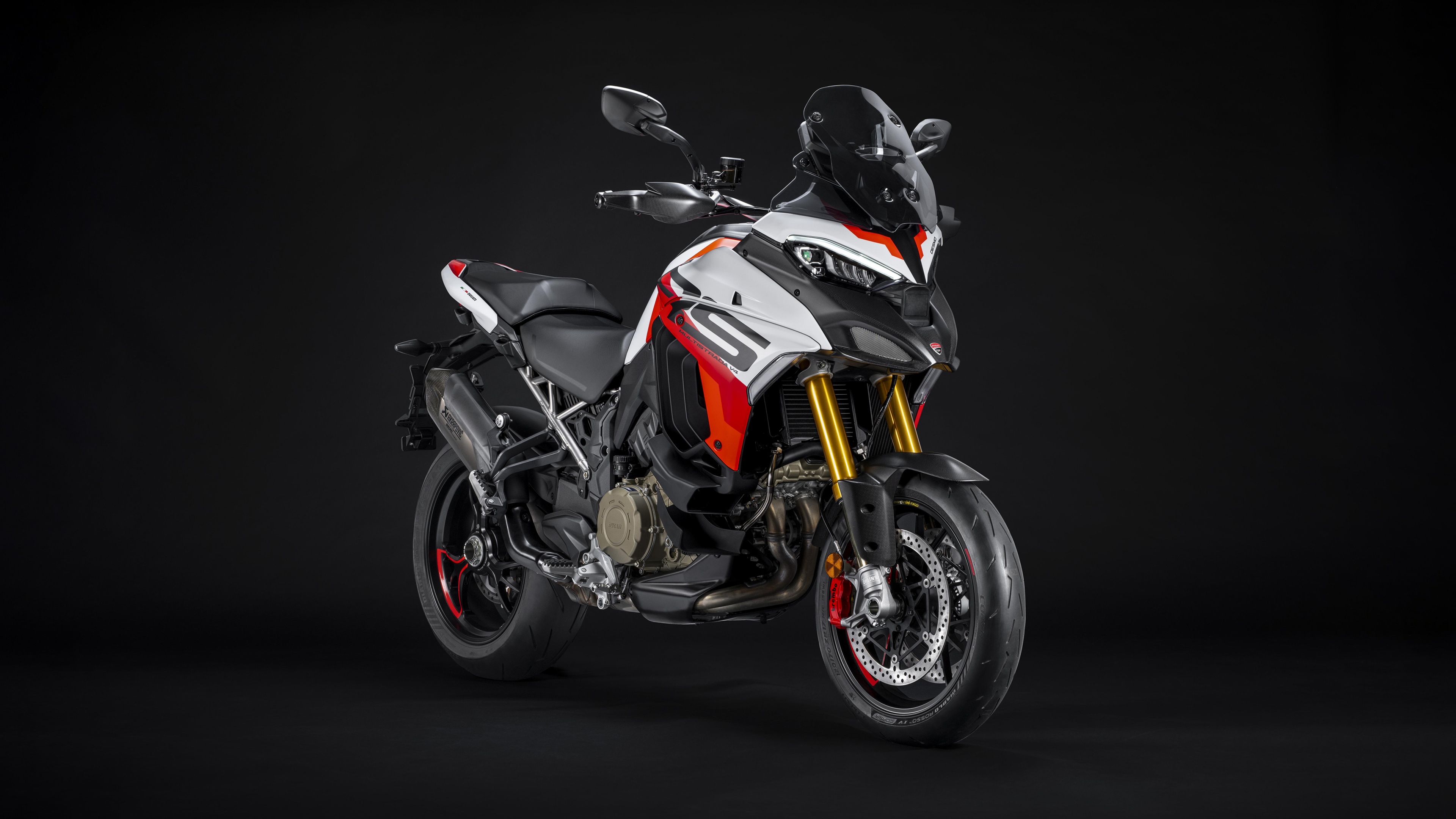 A detailed close-up of the 2024 Ducati Multistrada V4 RS adventure motorcycle in a professional studio setting.
