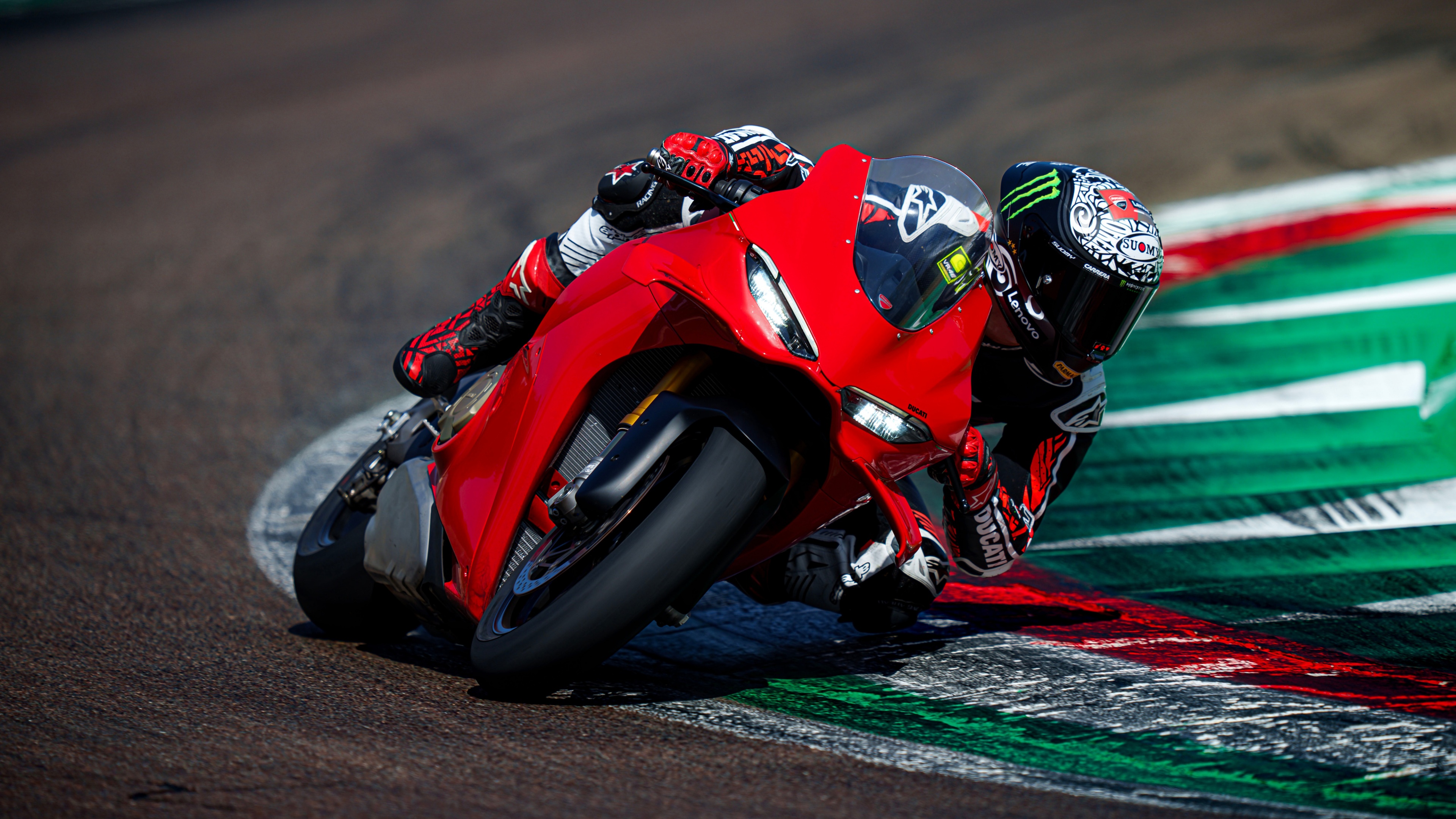 A 2024 Ducati Panigale V4 S racing motorcycle on a professional race track.