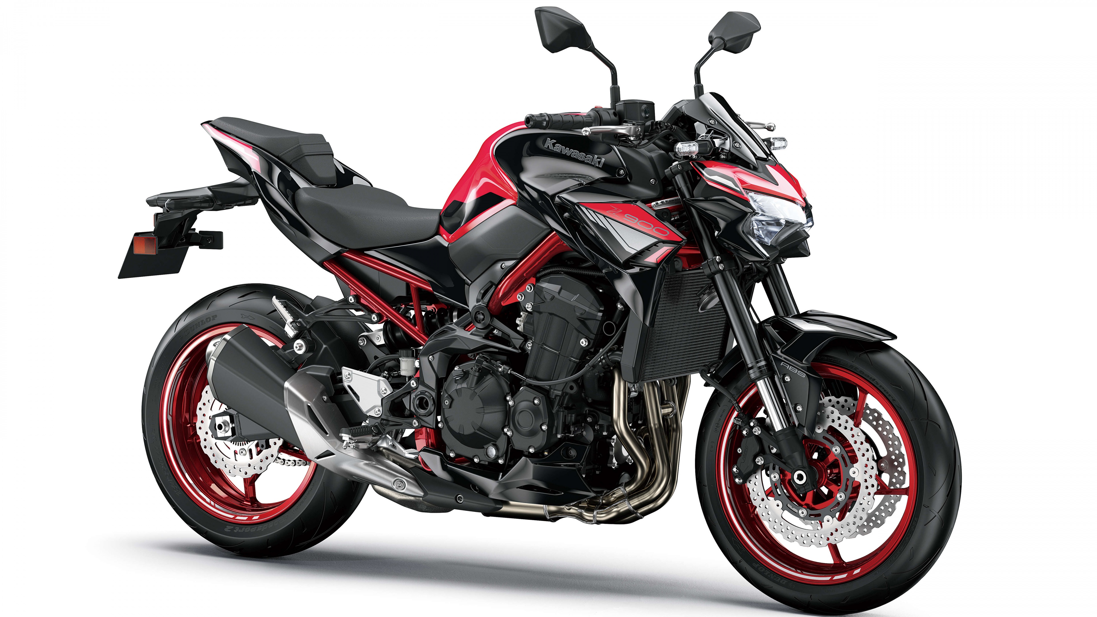A sleek 2024 Kawasaki Z900 sports motorcycle isolated on a white background.