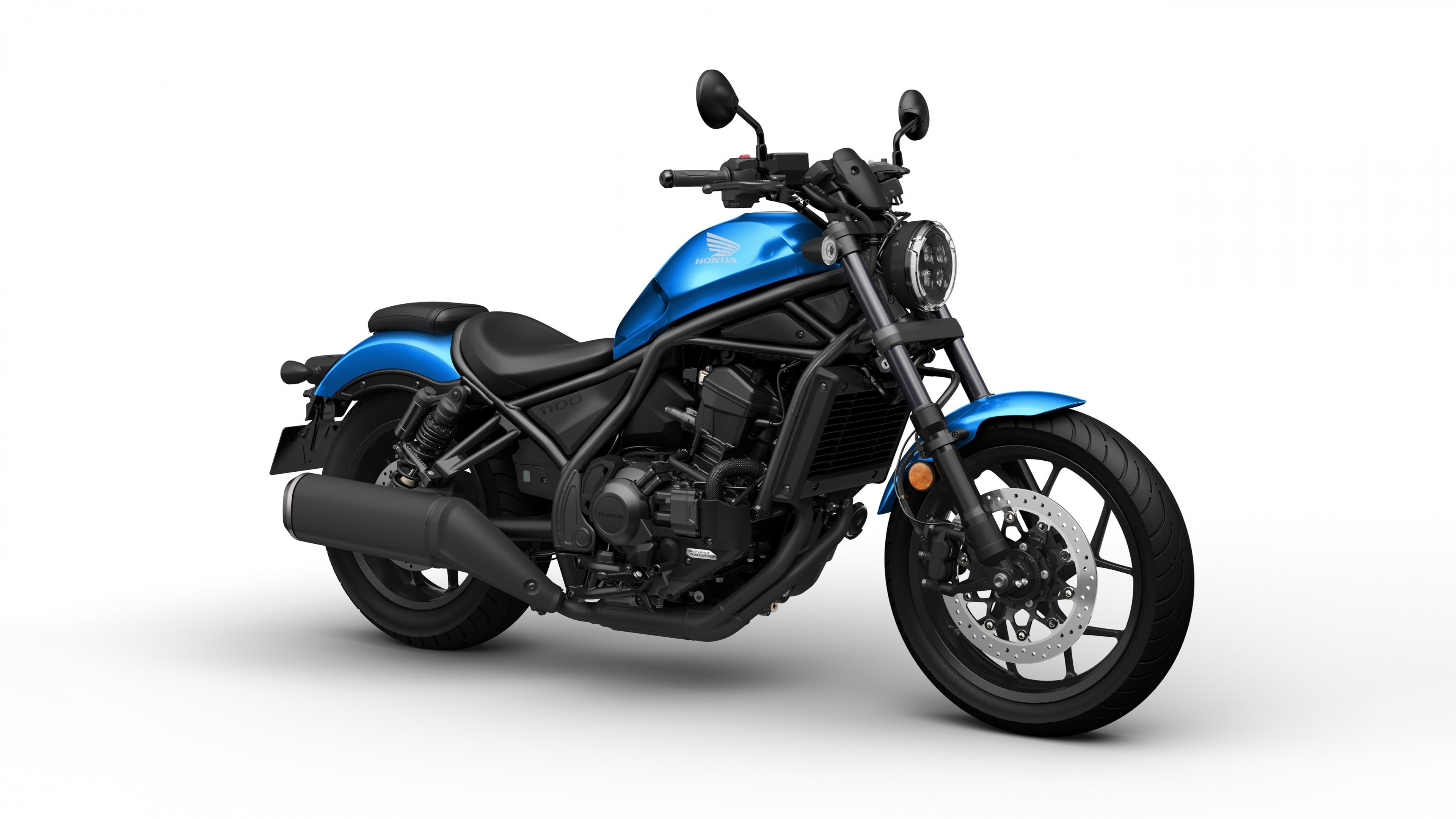A high-resolution studio shot of a 2024 cruiser motorcycle isolated on a white background.