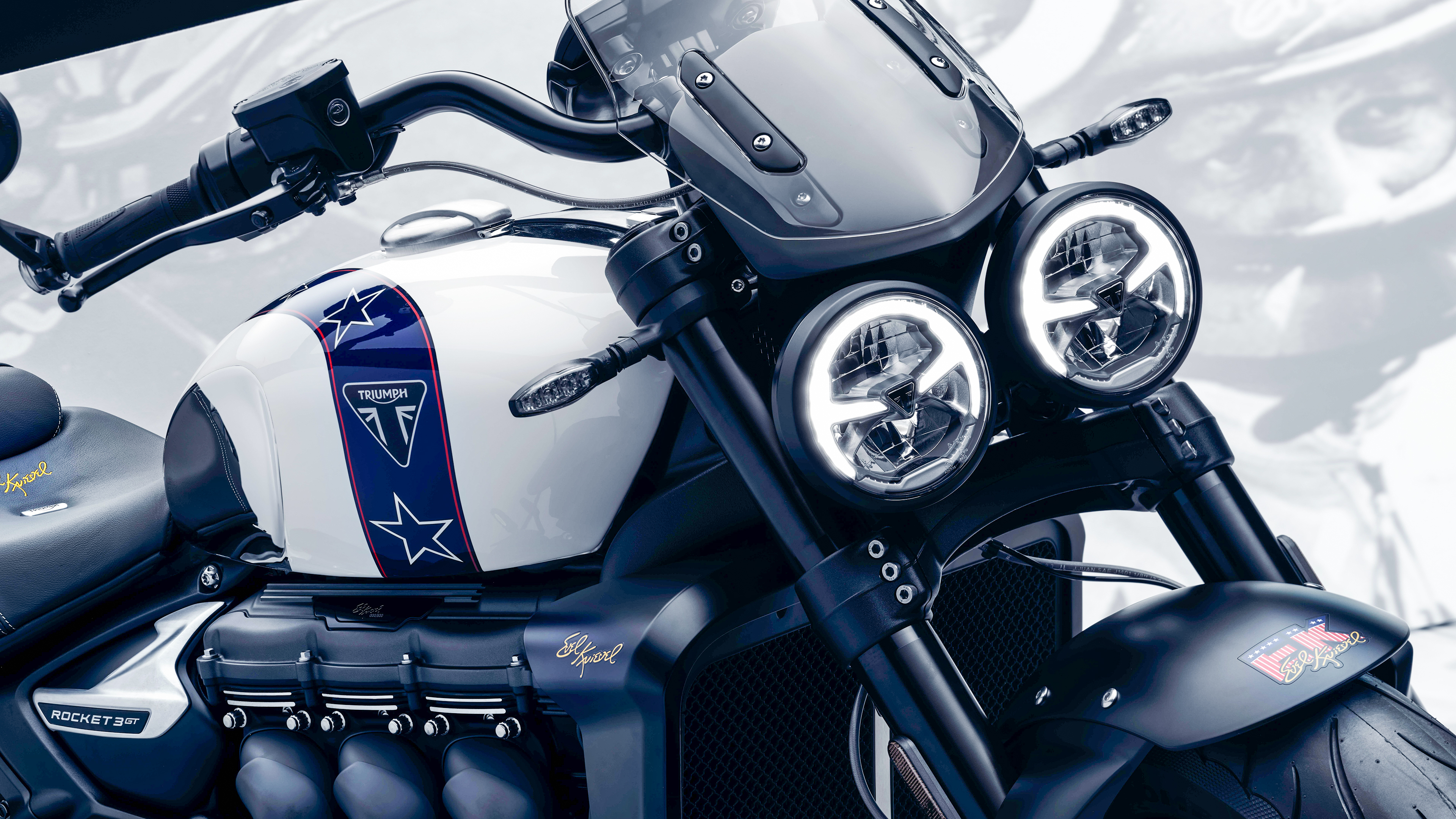 A detailed view of the 2024 Triumph Rocket 3 Roadster motorcycle, highlighting its powerful roadster engineering.