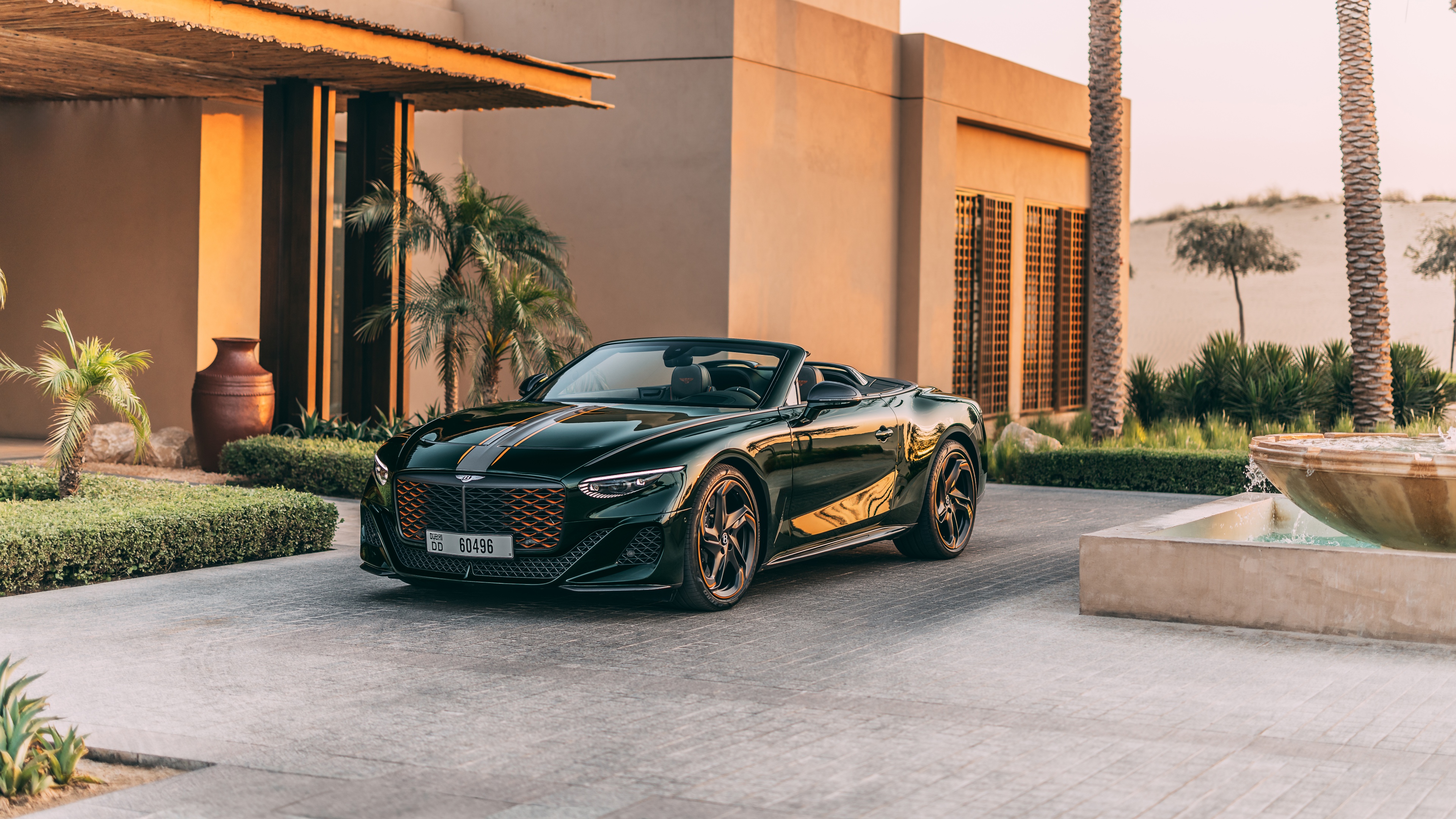 A high-resolution, detailed shot of a 2025 Bentley Mulliner Batur Convertible parked outdoors in natural light.
