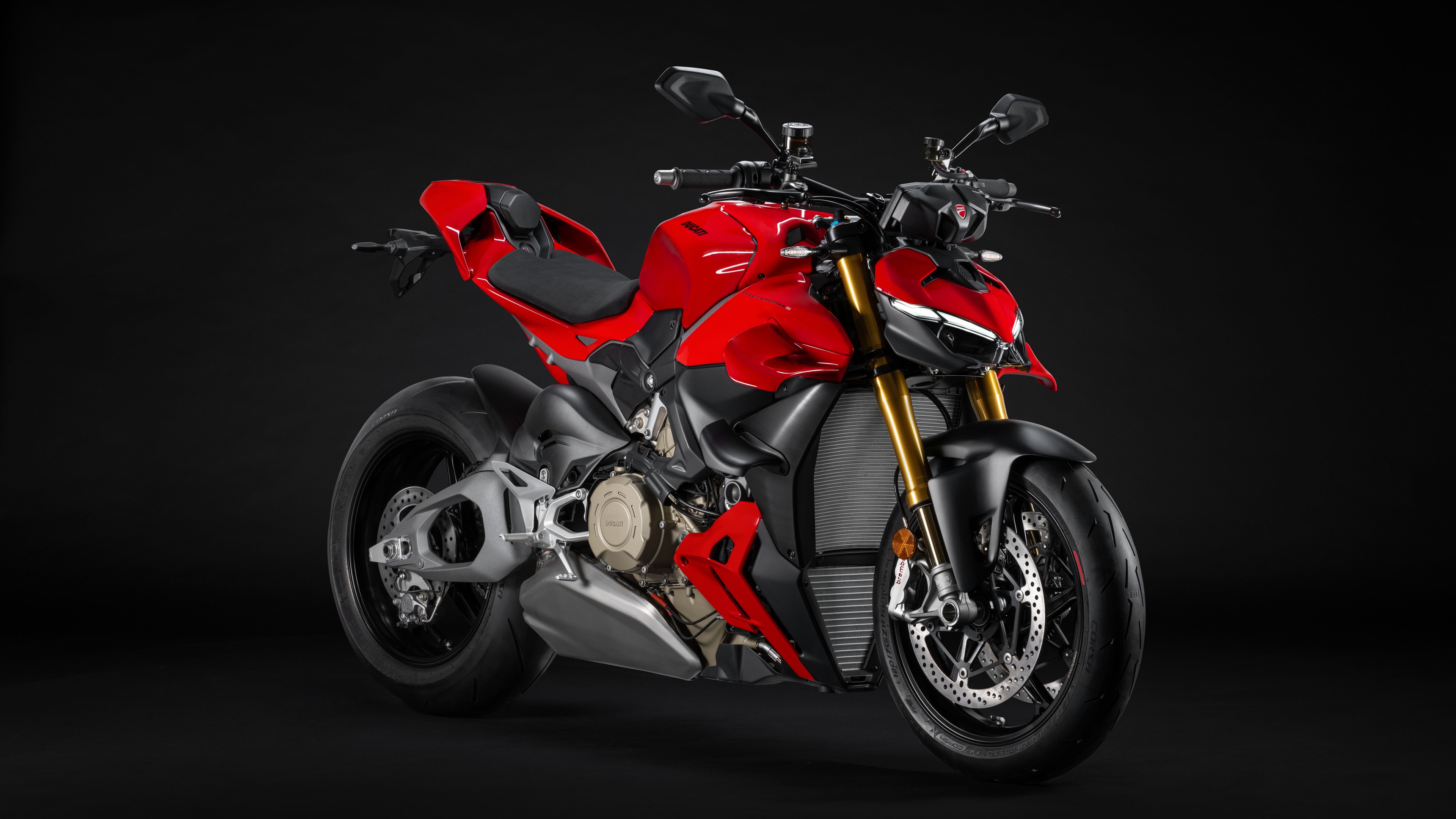 A red 2025 Ducati Streetfighter V4 S sports motorcycle set against a dark, moody background.